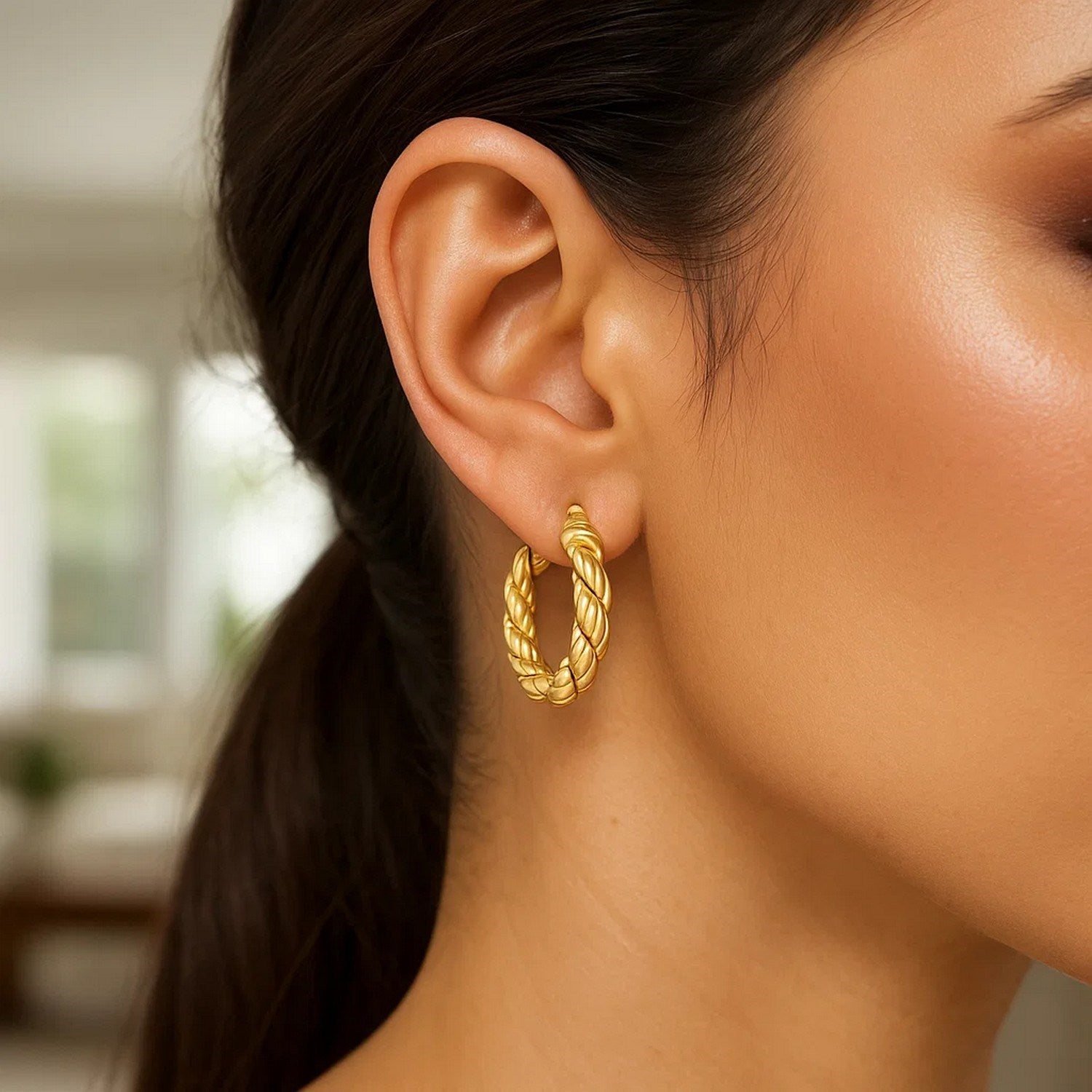 14k yellow gold classic rope hoop earrings showcasing elegant craftsmanship and timeless design.