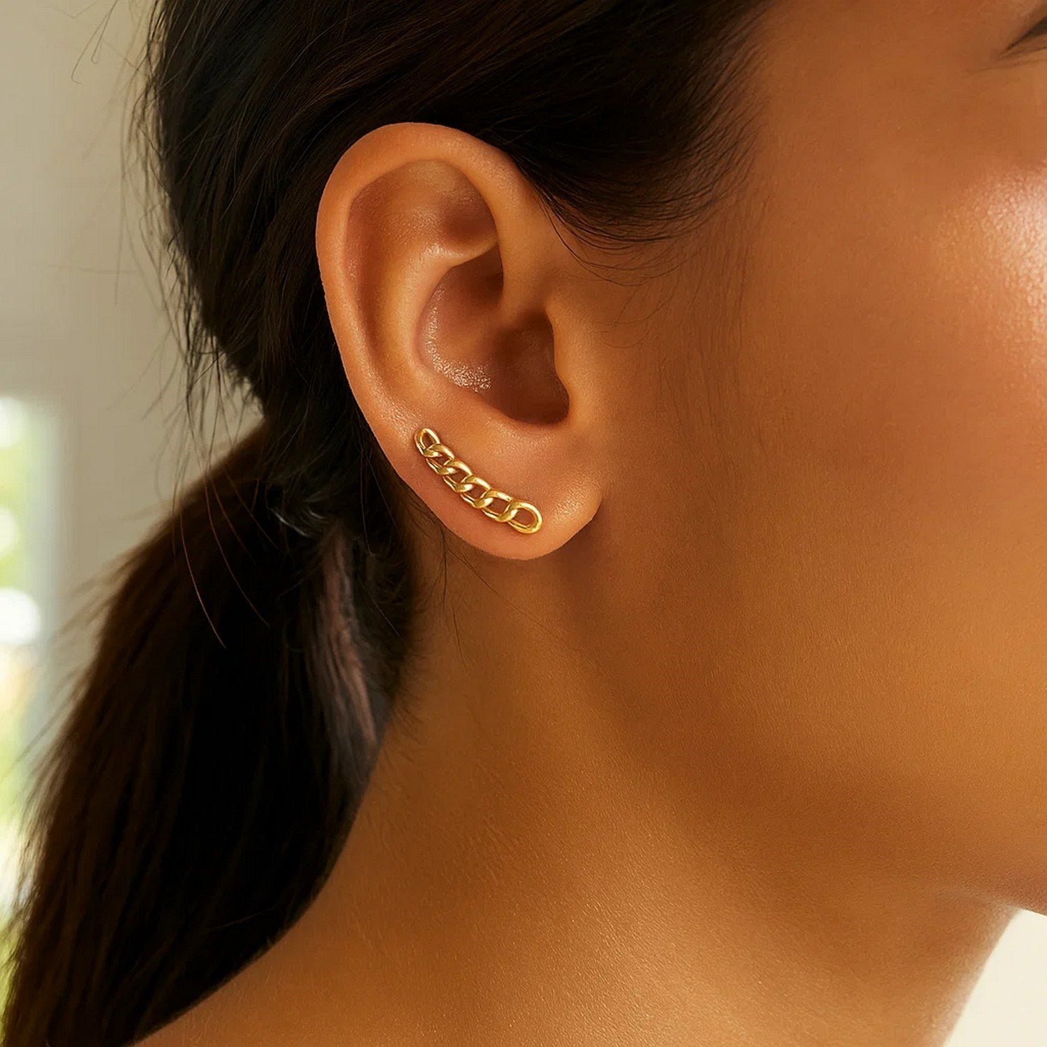 14k yellow gold chain link ear climber earrings showcasing a modern design with elegant interlocking links.