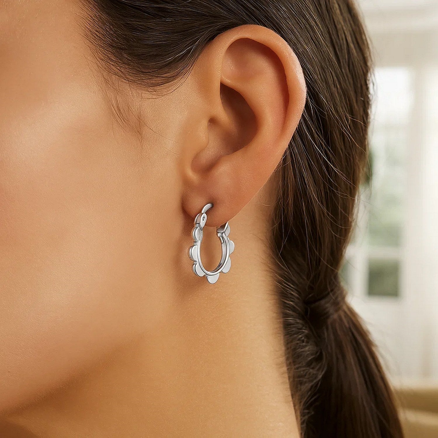14k white gold scalloped hoop earrings featuring a modern design with elegant curves and a polished finish.