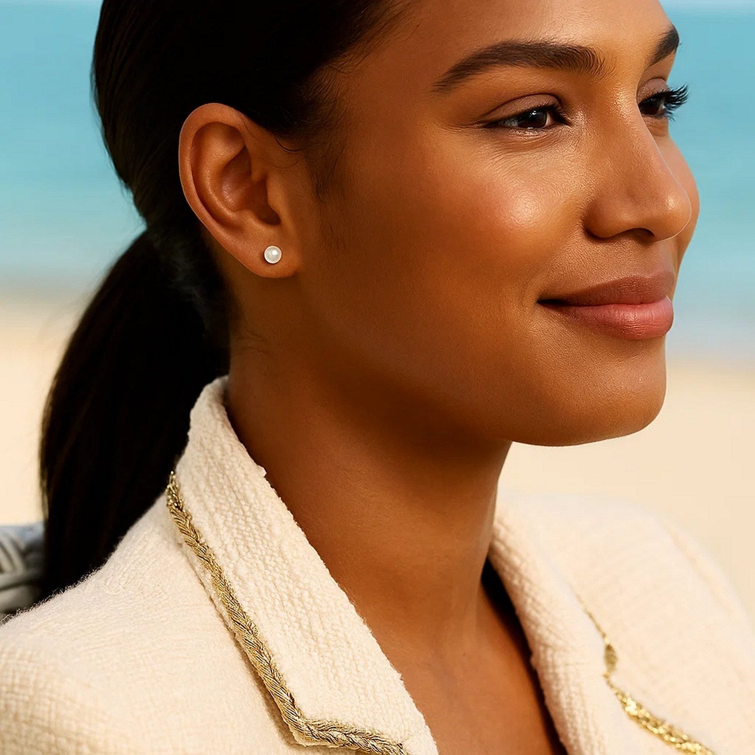 Elegant 14k yellow gold stud earrings featuring 4mm freshwater cultured pearls for a timeless luxury look.