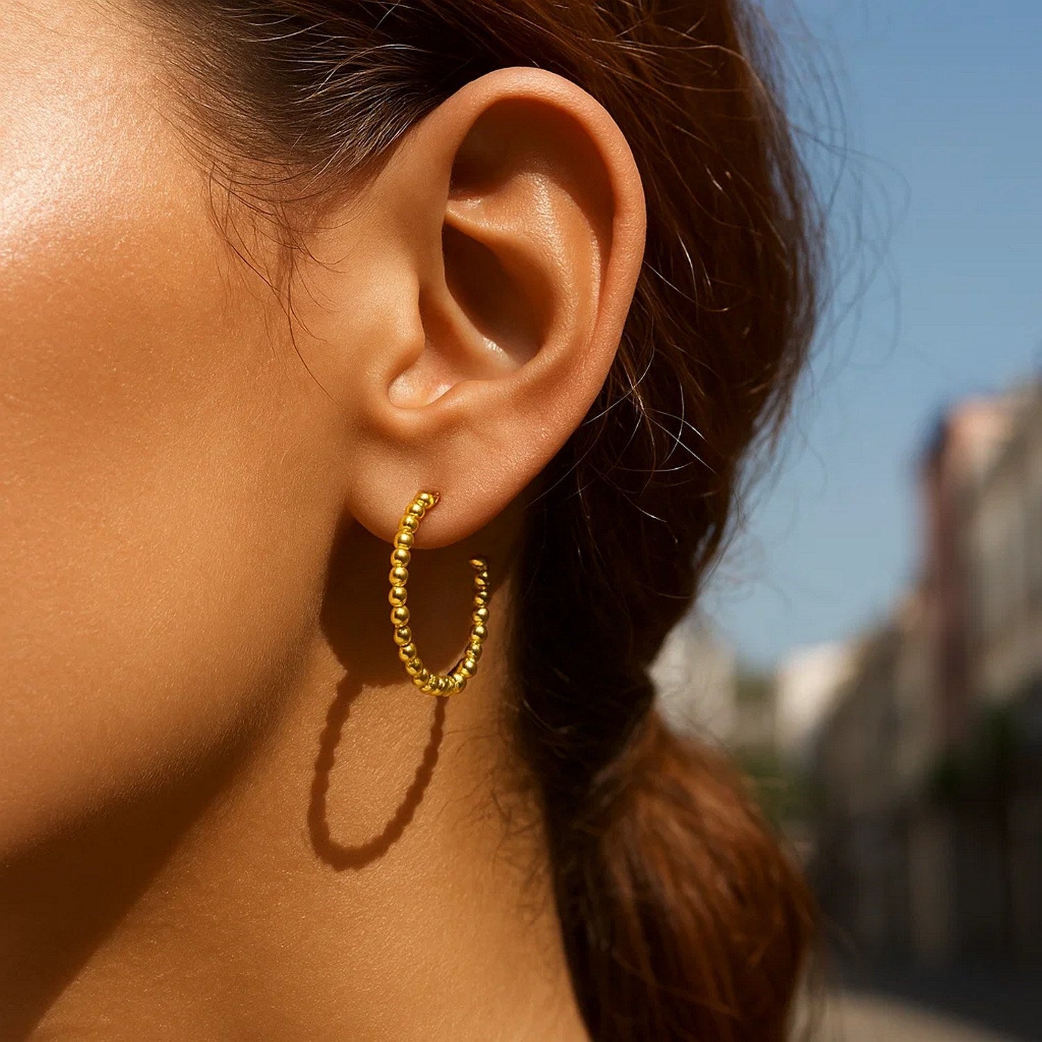14k yellow gold modern beaded hoop earrings showcasing elegant craftsmanship and timeless design.
