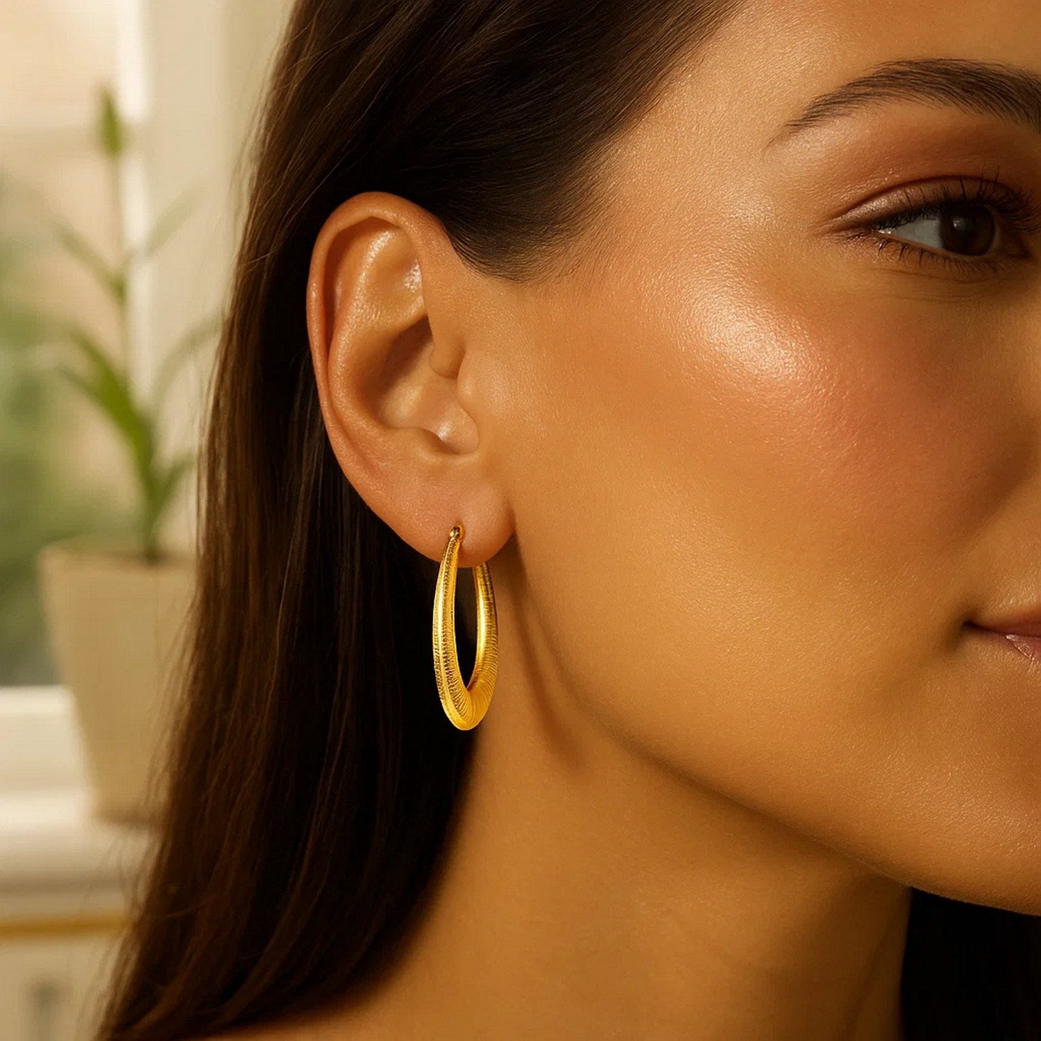 14k yellow gold graduated textured hoop earrings, showcasing a classic design for timeless elegance.