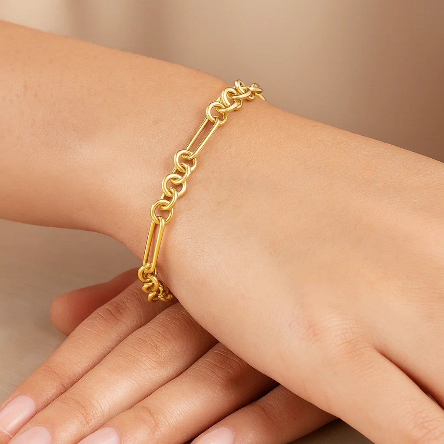 14k yellow gold modern paperclip link bracelet showcasing elegant chain design and luxurious shine.