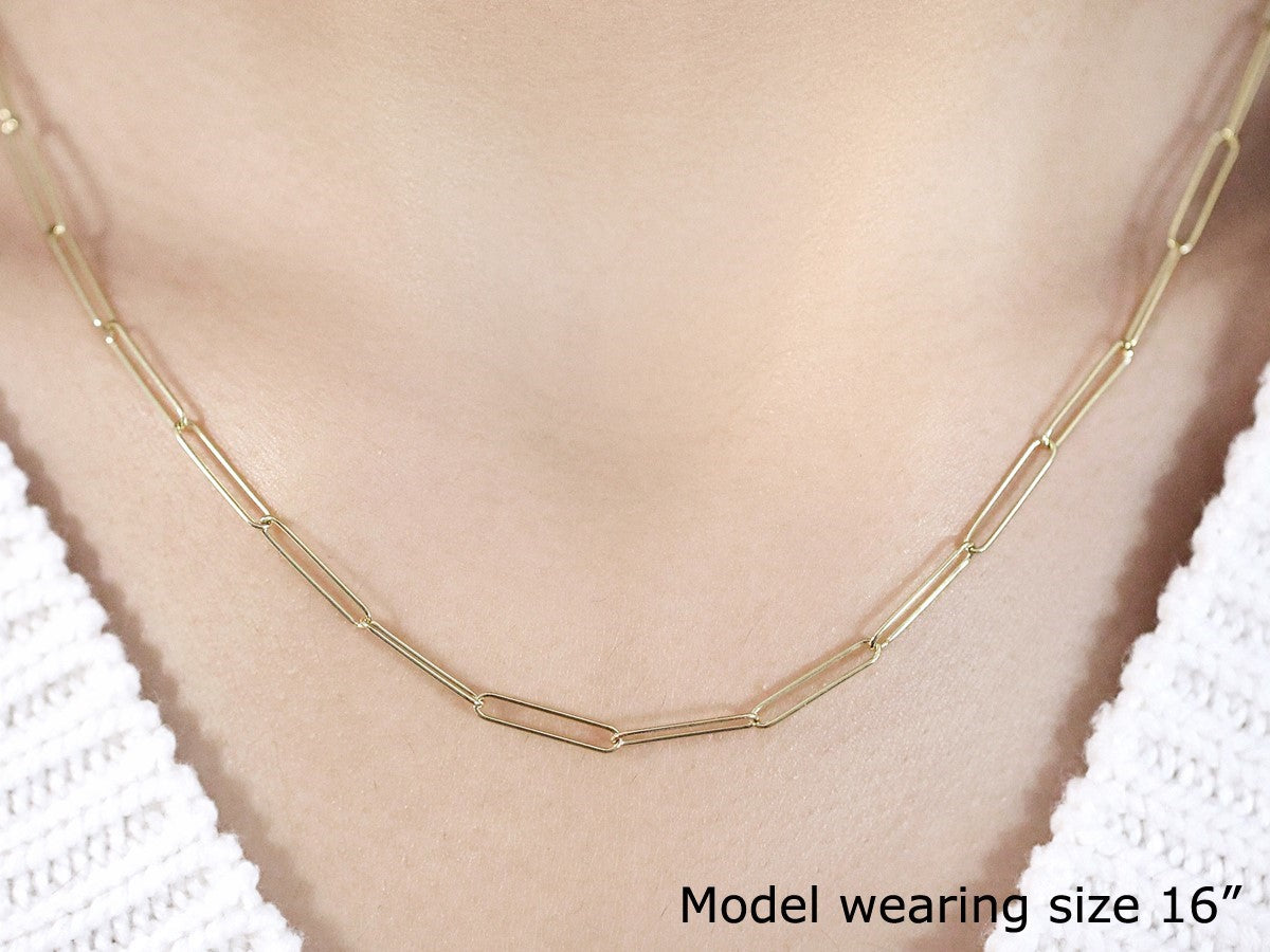 14k yellow gold wire paperclip chain with modern links, perfect for layering or as a statement piece.