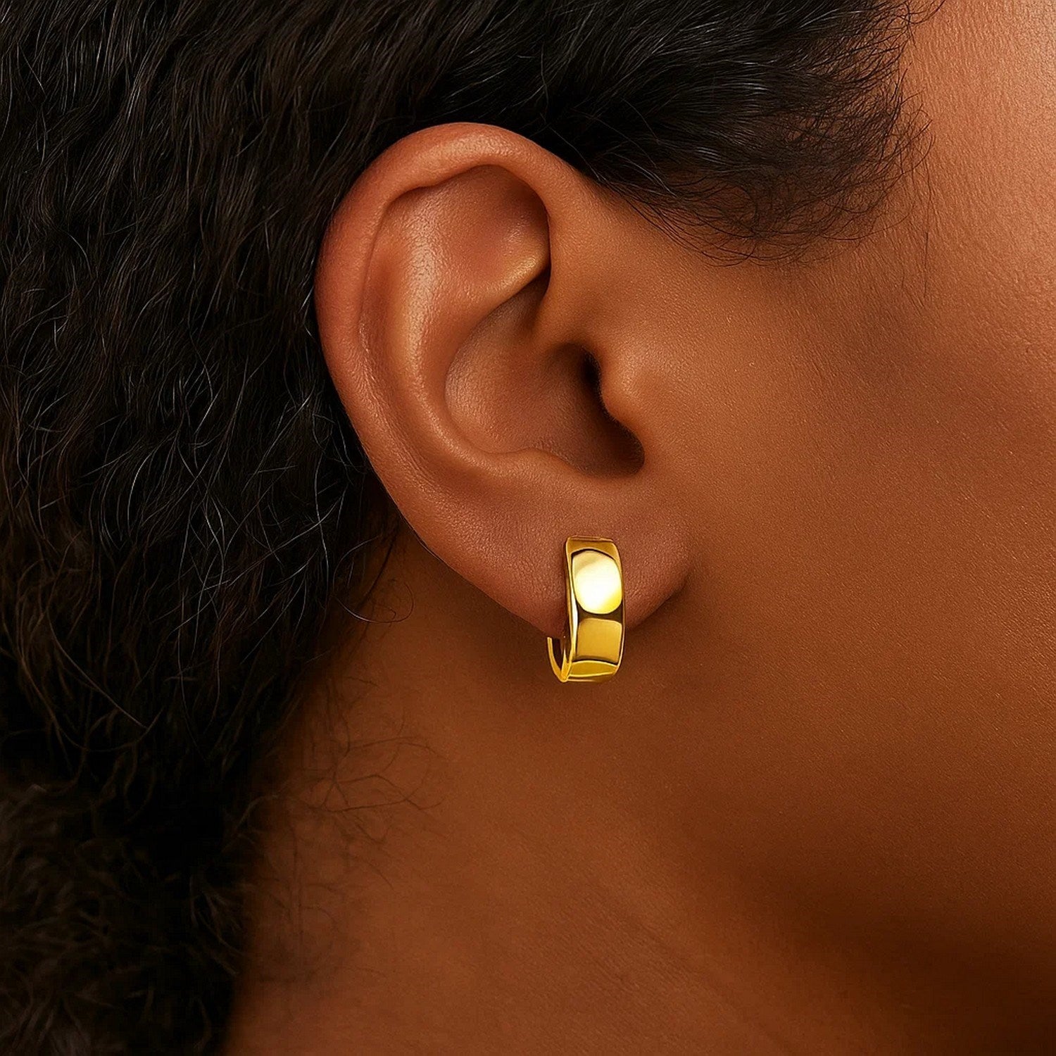 14k yellow gold contemporary hoop earrings with a sleek, snuggable design for effortless elegance.