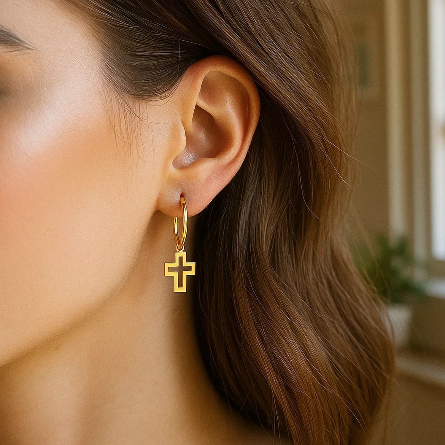 14K yellow gold polished hoop earrings featuring elegant cross accents for a luxurious touch.