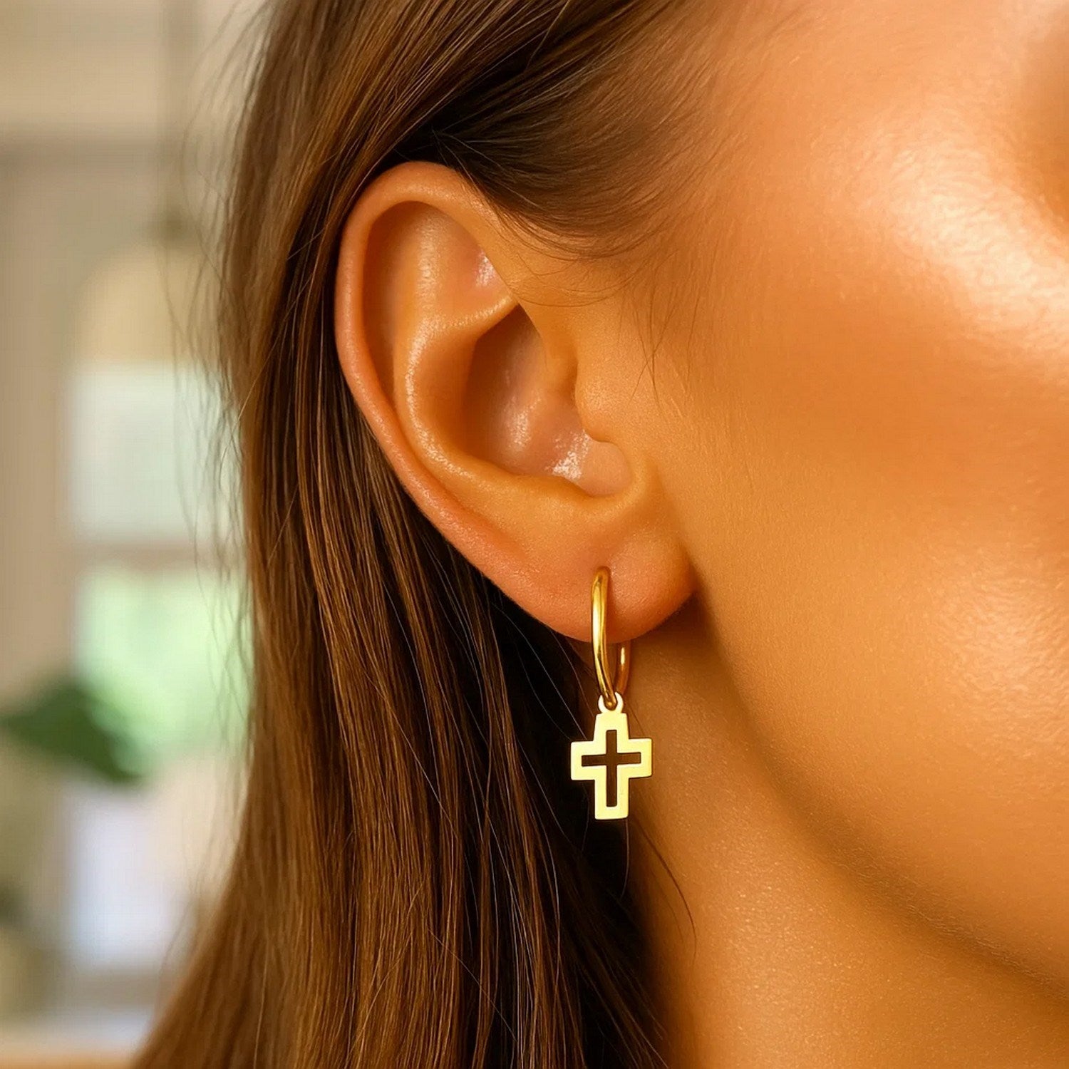 14K yellow gold polished hoop earrings featuring elegant cross designs for a timeless luxury statement.