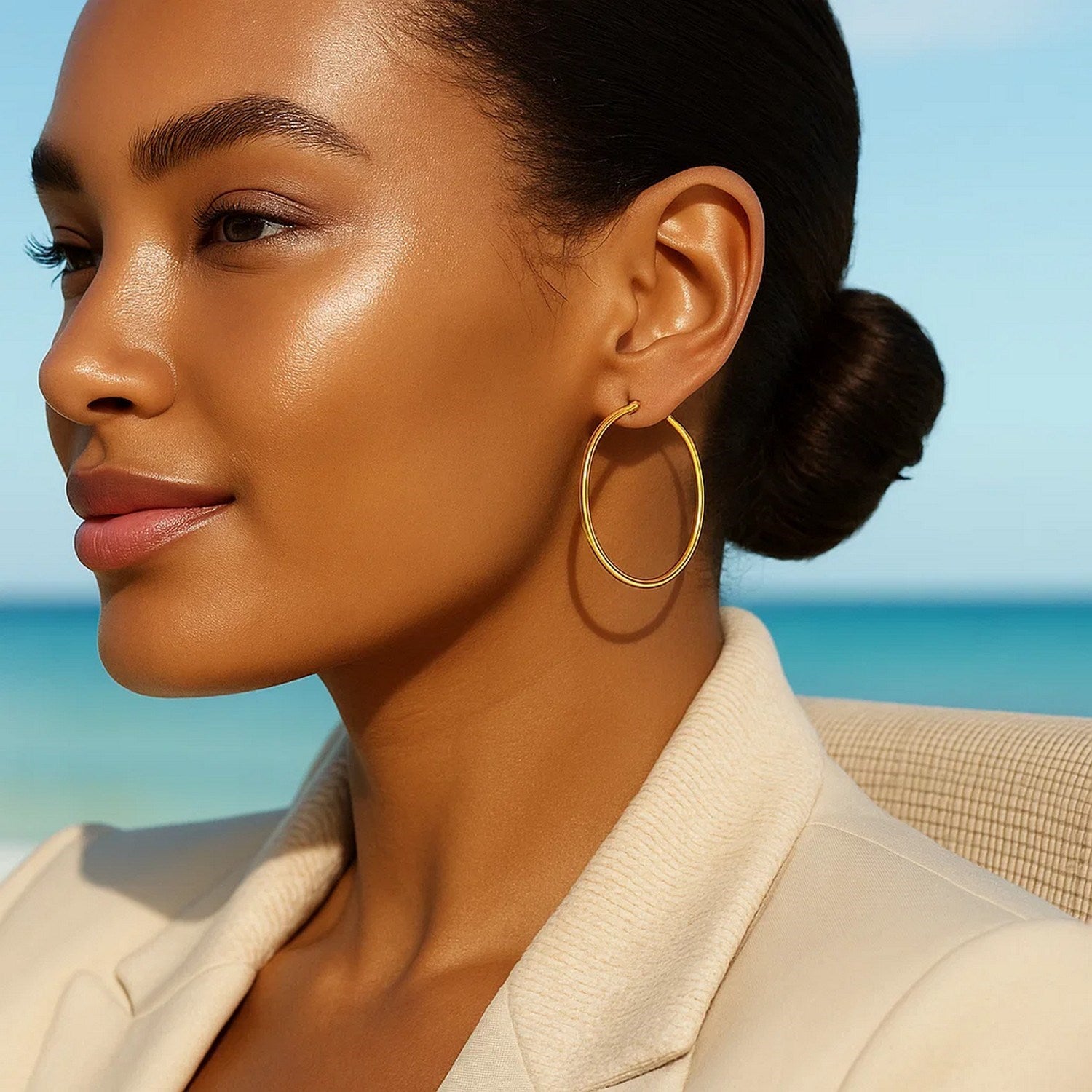 14k yellow gold polished hoop earrings, contemporary design, 40 mm diameter, perfect for elegant everyday wear.
