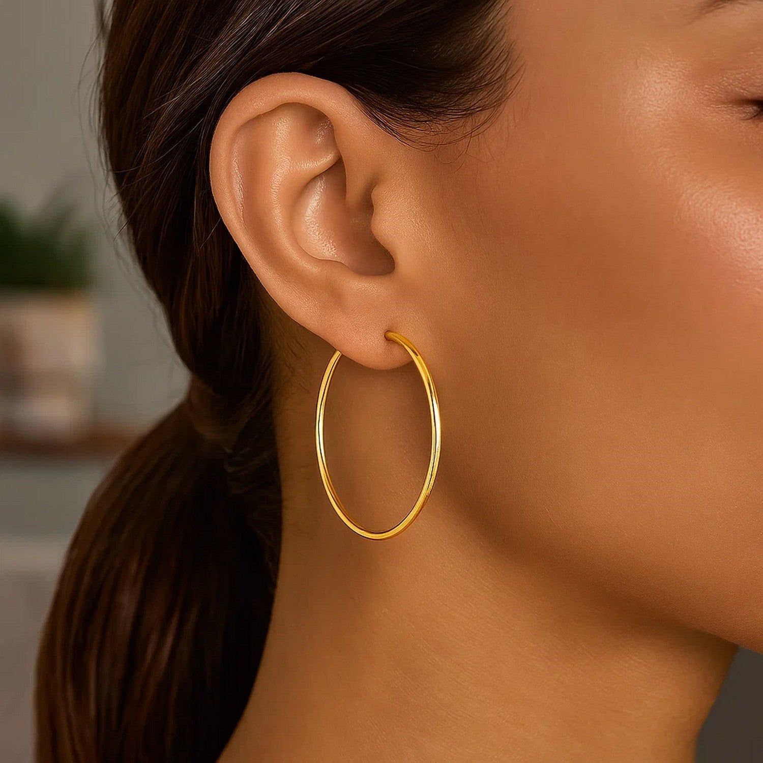 14k yellow gold polished hoop earrings, contemporary design, 40 mm diameter, perfect for elegant occasions.