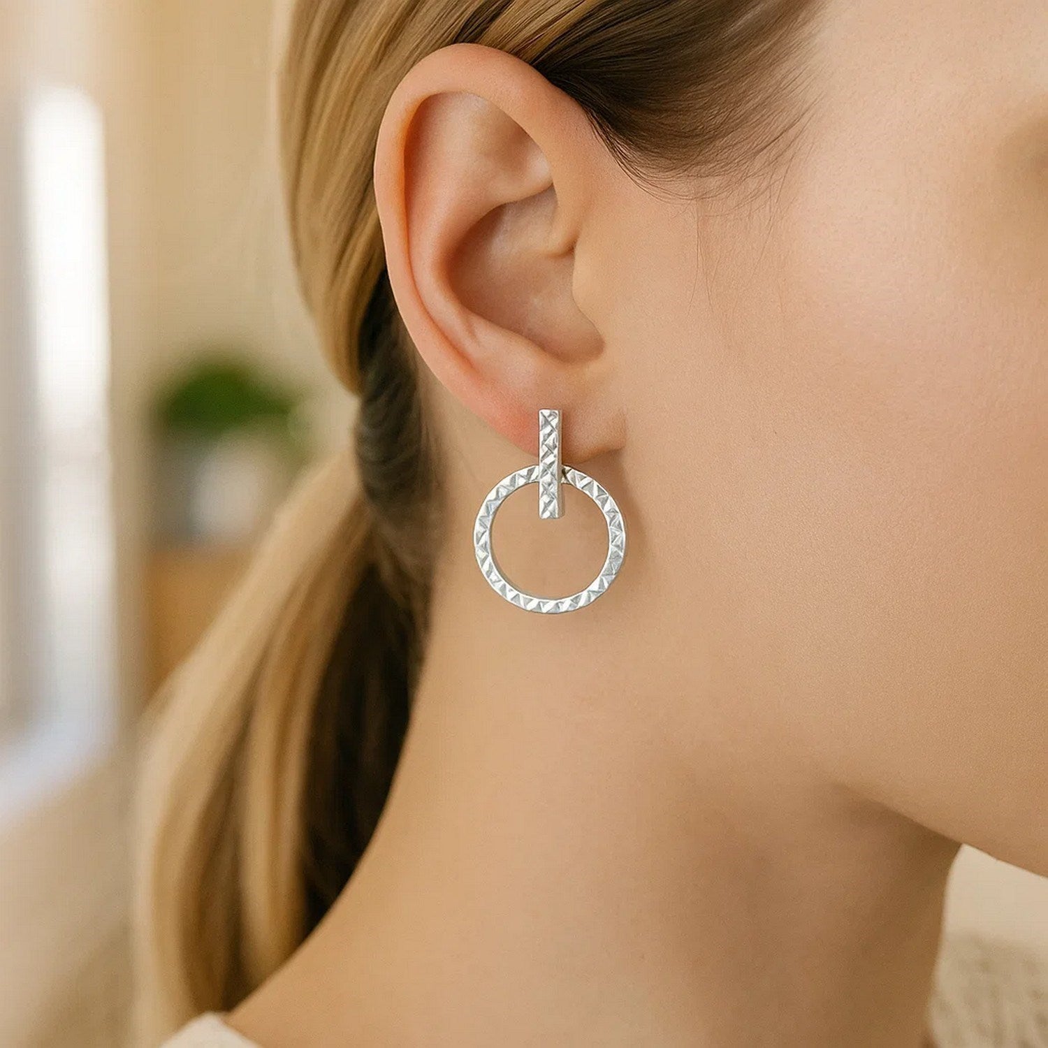 14k white gold textured circle and bar earrings showcasing modern luxury and exquisite craftsmanship.