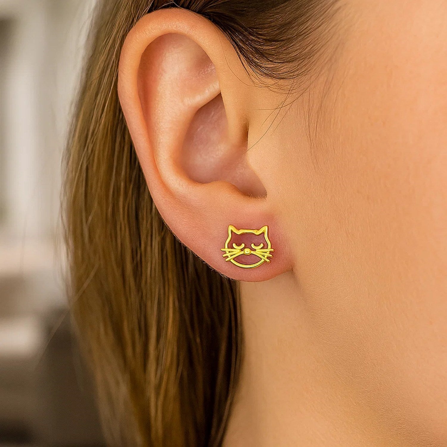 14k yellow gold modern cat head stud earrings showcasing exquisite craftsmanship and playful elegance.