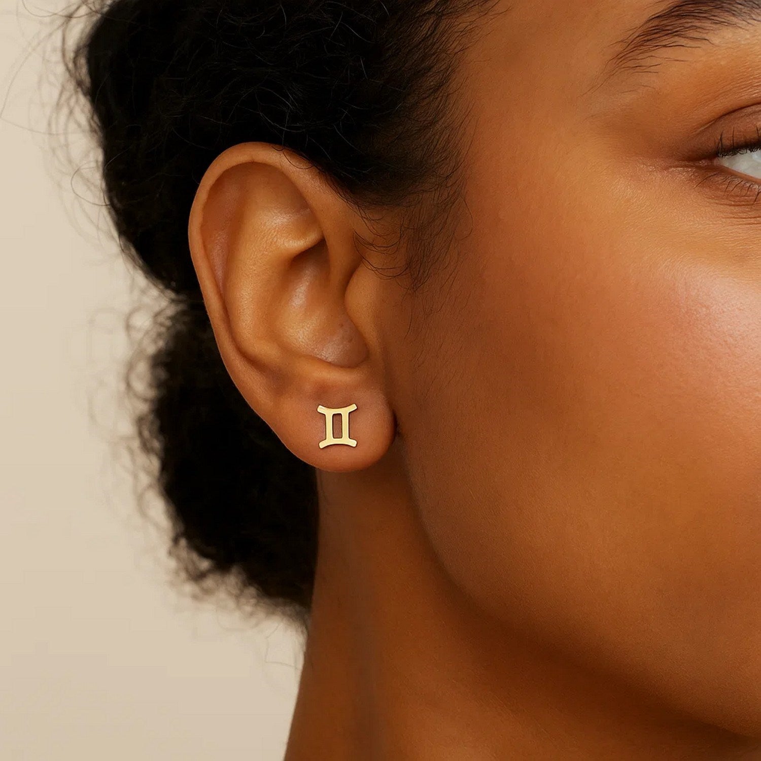 14K yellow gold modern stud earrings featuring a sleek design, perfect for elegant everyday wear.