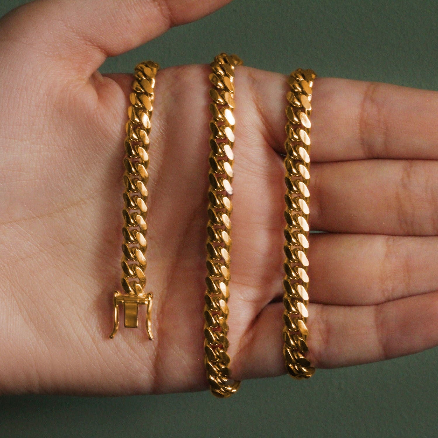 14k yellow gold classic Miami Cuban chain, 6.10 mm, featuring a timeless round link design for elegant sophistication.