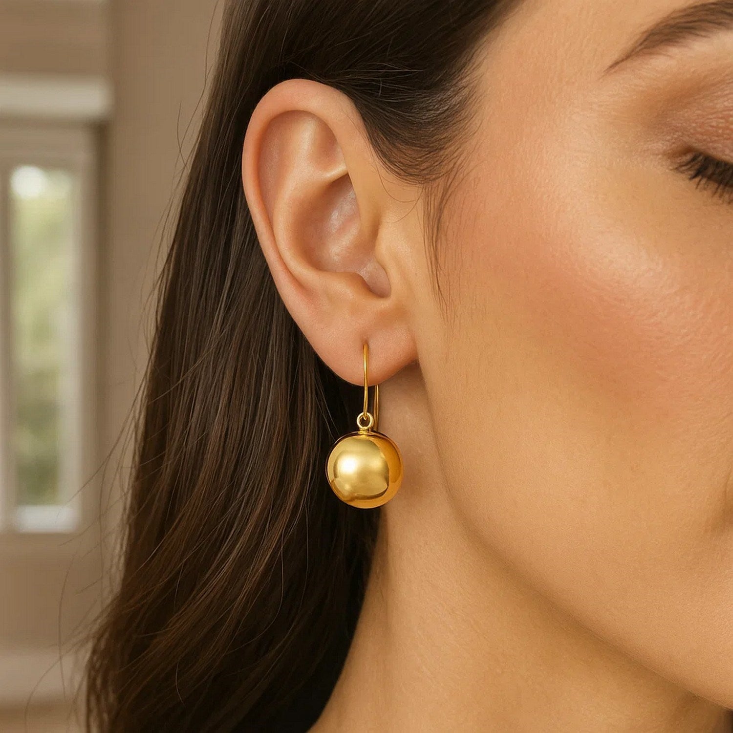 14k yellow gold modern puffed circle drop earrings showcasing elegant design and luxurious shine.