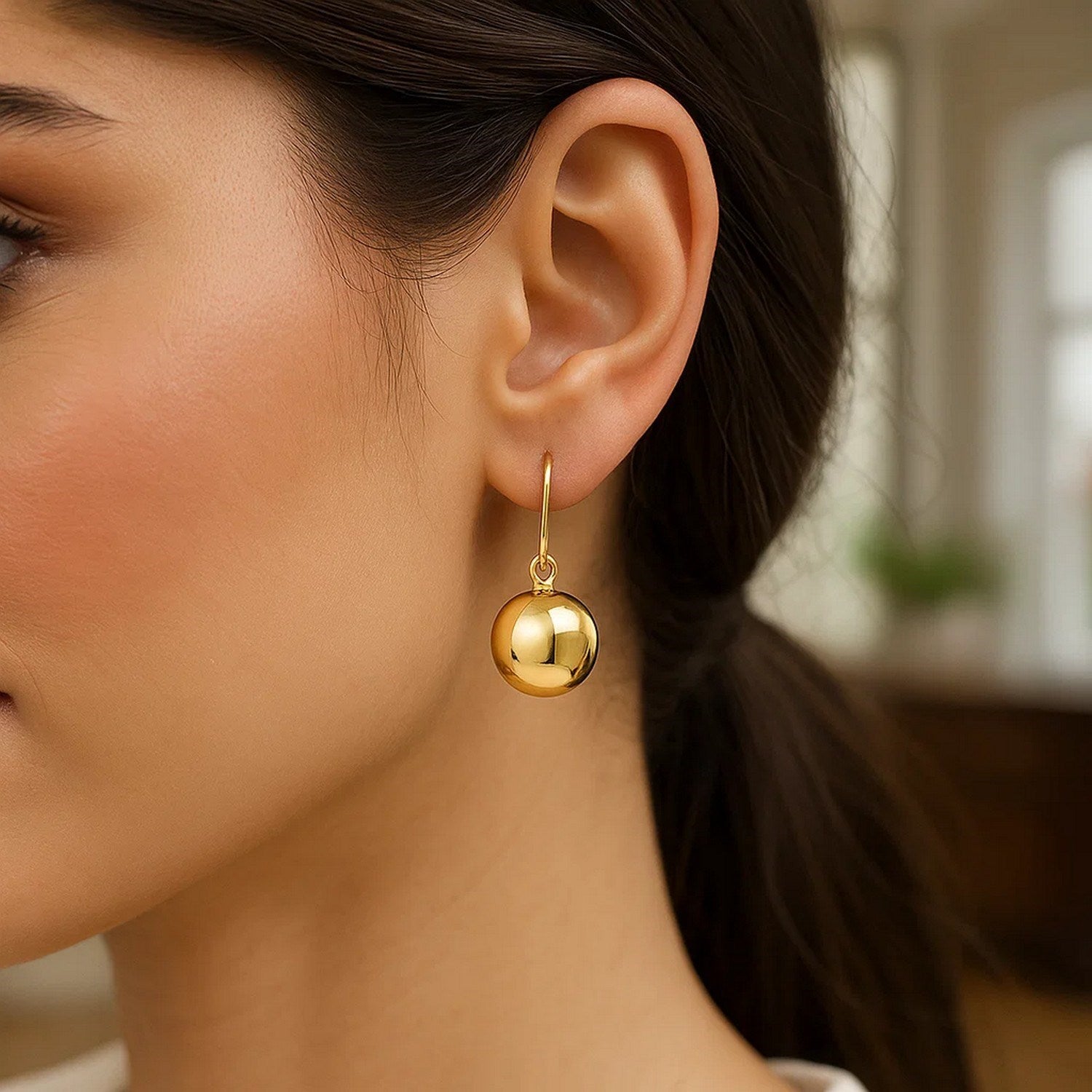 14k yellow gold modern puffed circle drop earrings showcasing elegant design and luxurious craftsmanship.