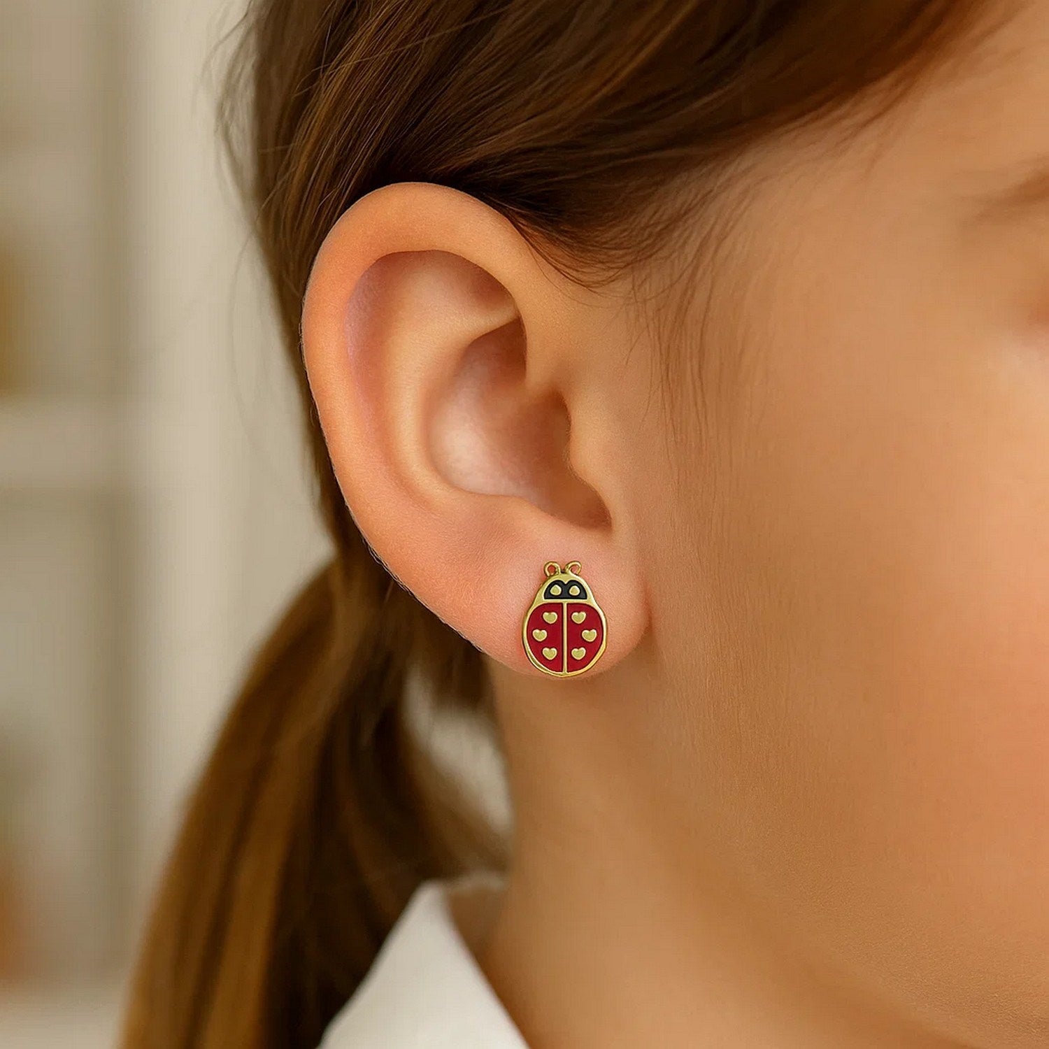 14k yellow gold dangle earrings featuring elegant ladybug enamel design, perfect for sophisticated style.