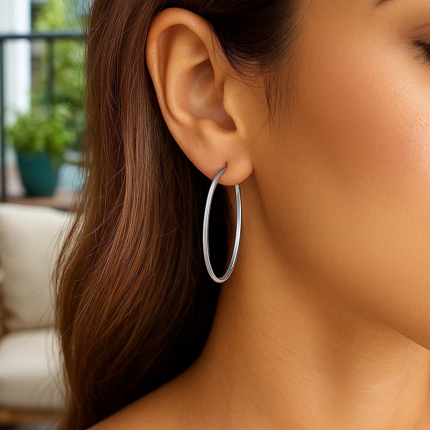 14k white gold polished slim oval hoop earrings with a contemporary design, perfect for elegant occasions.