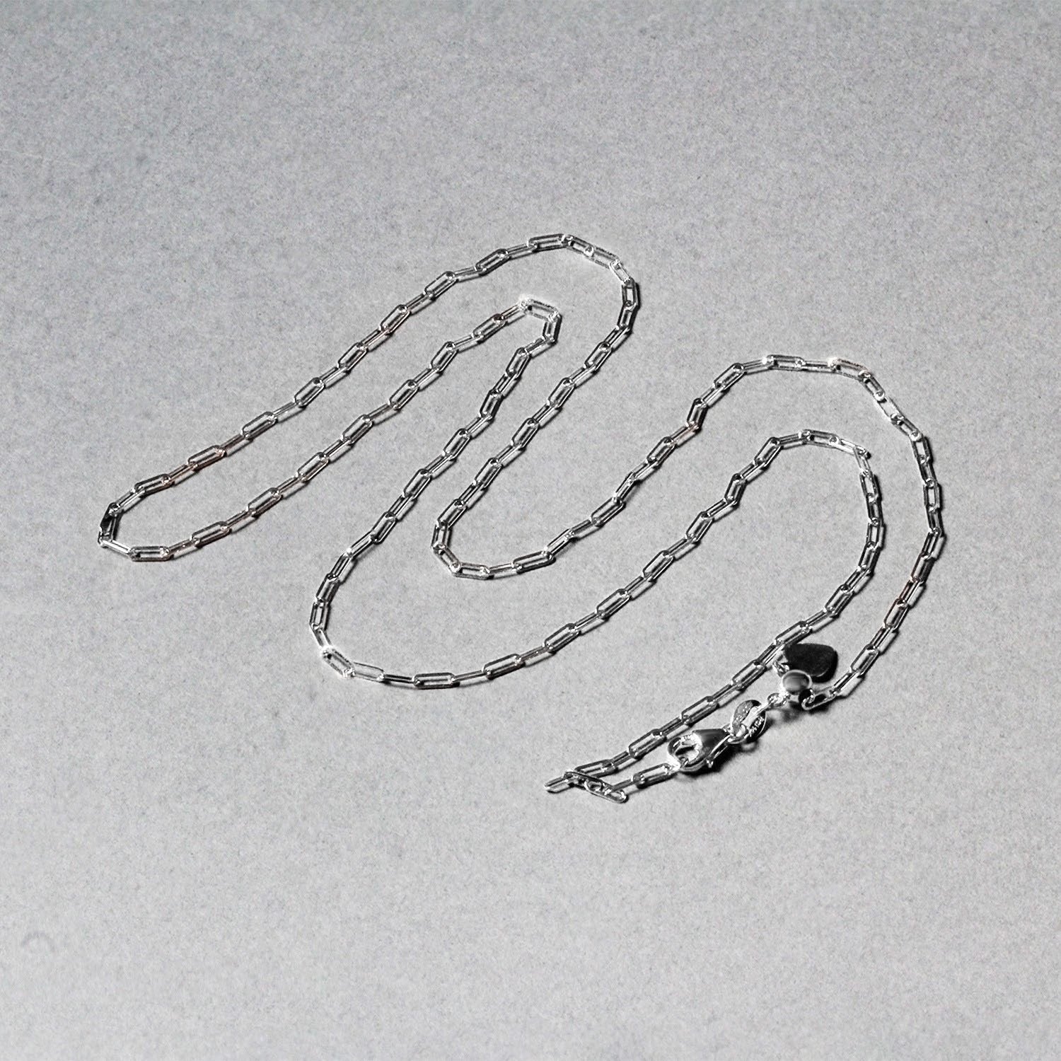 14k white gold adjustable paperclip chain with modern links, perfect for layering or wearing solo.