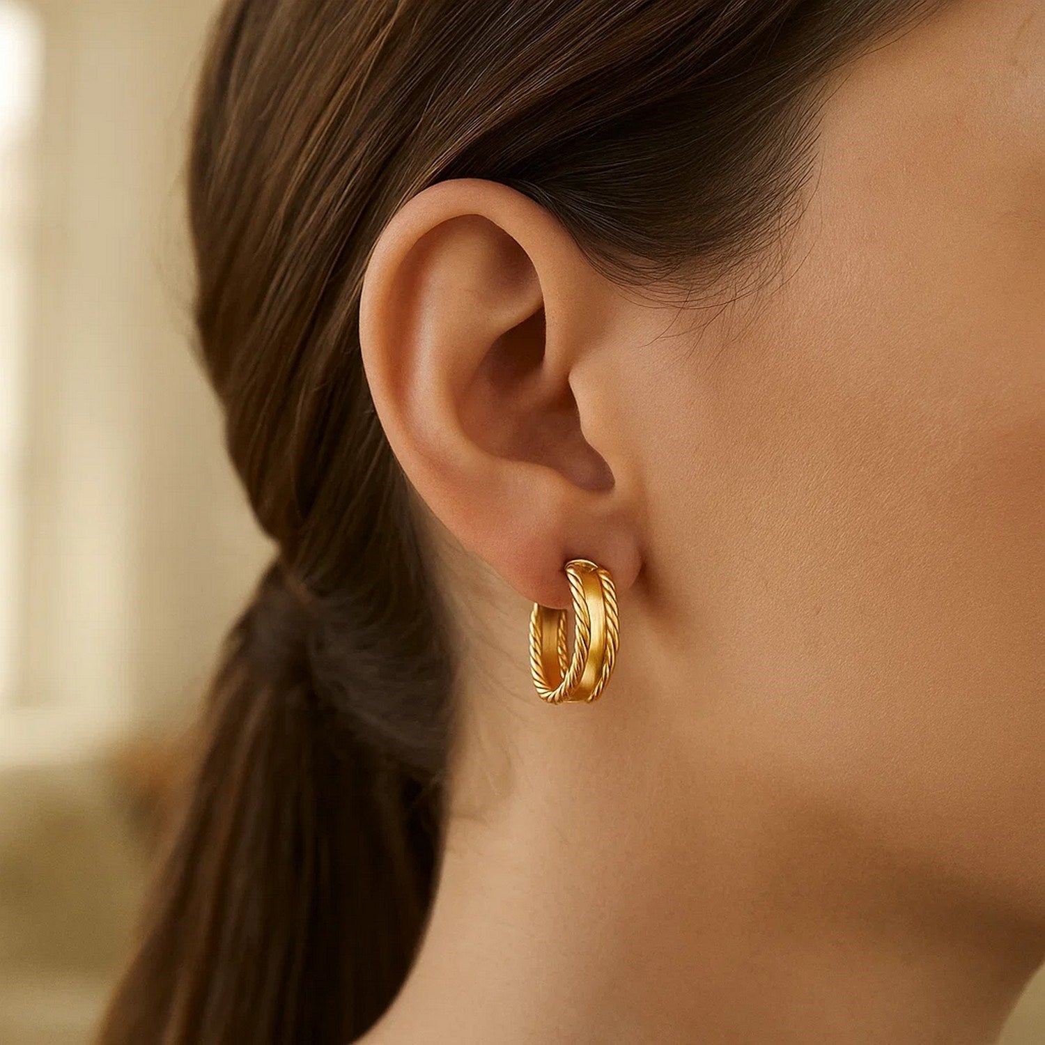 14K yellow gold modern triple row hoop earrings showcasing elegant craftsmanship and timeless design.