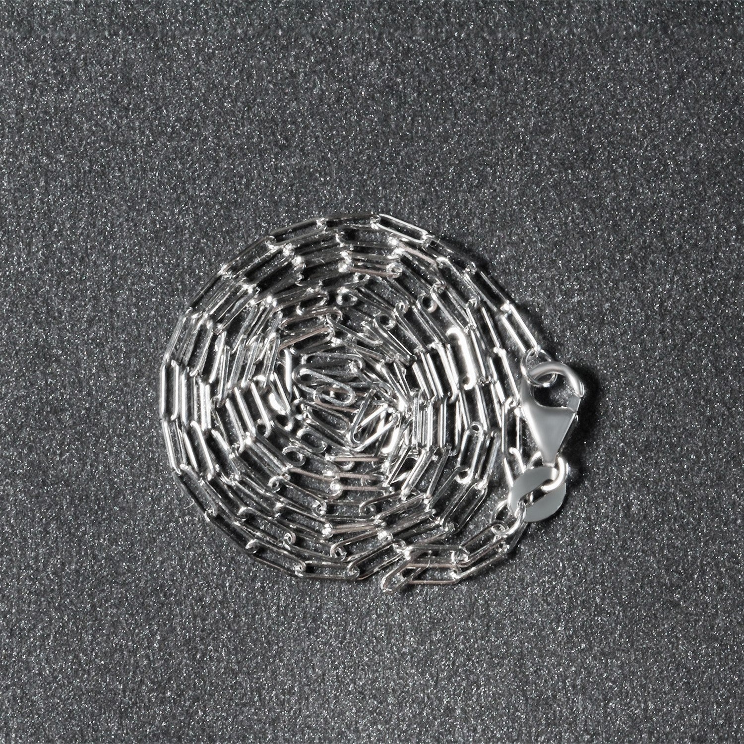 14k white gold fine paperclip chain with modern design, featuring sleek round links for a sophisticated look.