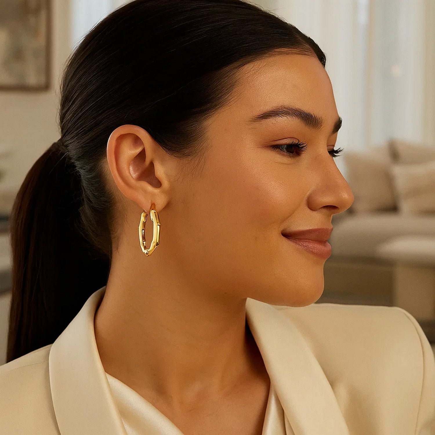 14k yellow gold polished bamboo hoop earrings with a modern design, perfect for elegant everyday wear.