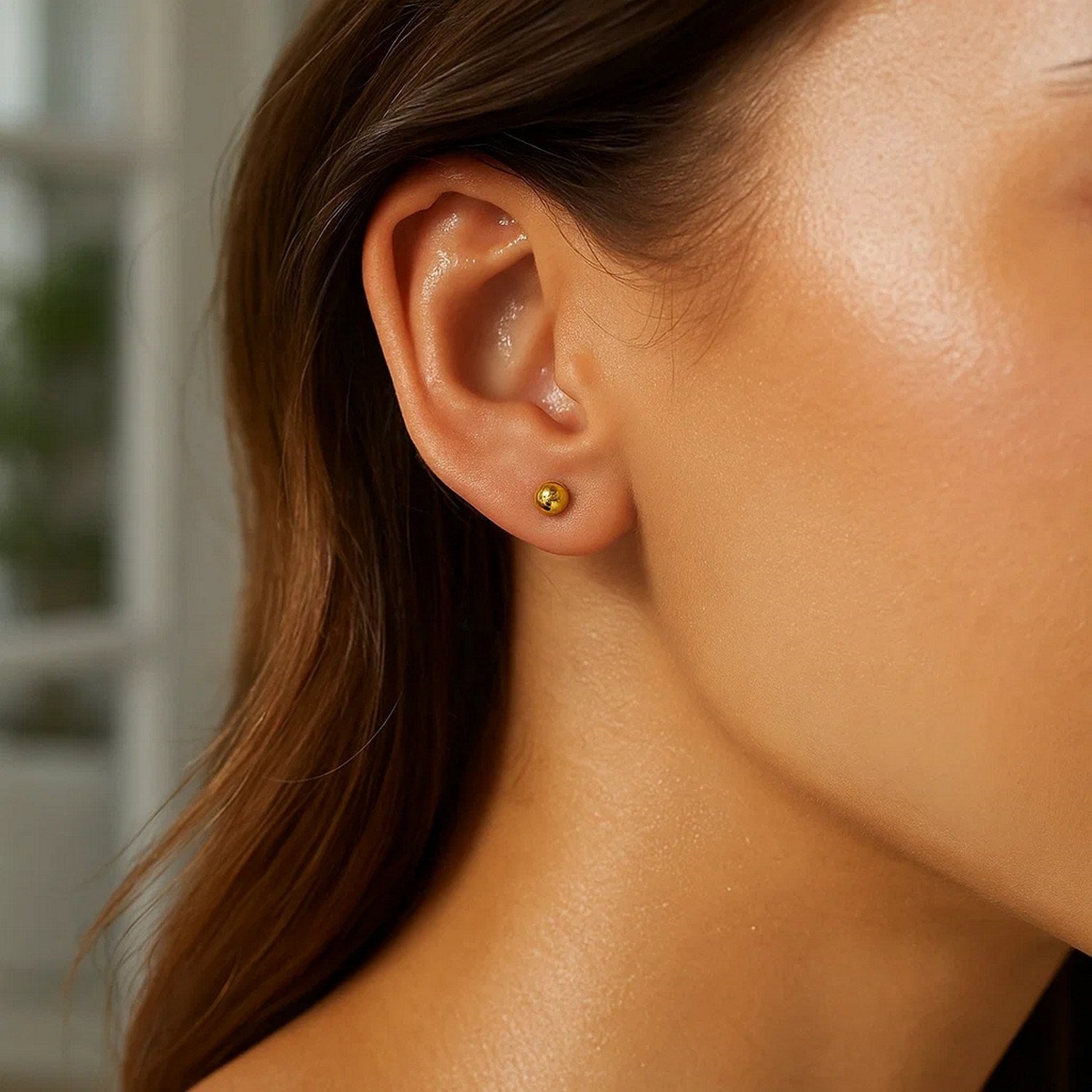 14k yellow gold polished ball style stud earrings, showcasing a classic design for timeless elegance.