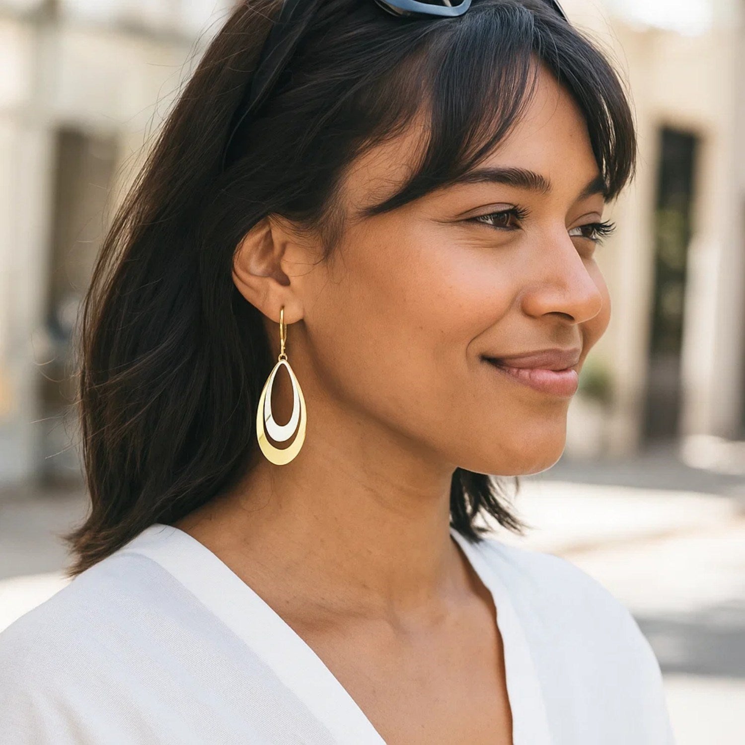 14k two-tone gold polished drop earrings featuring a sleek modern design, perfect for elegant occasions.