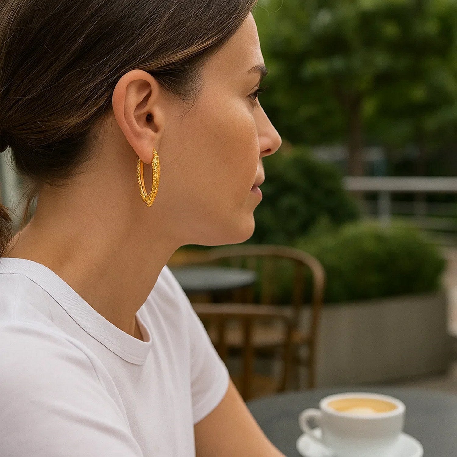 14k yellow gold modern V-shaped puffed hoop earrings, showcasing a sleek and elegant design for luxury style.