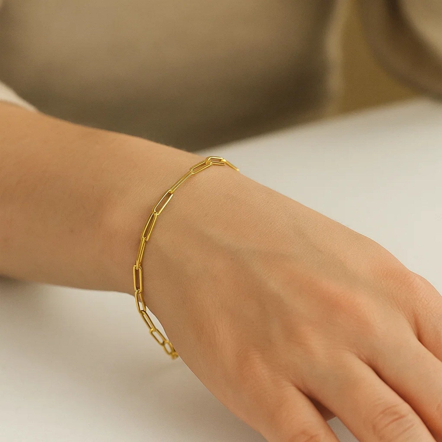 14k yellow gold paperclip bracelet featuring modern links, showcasing elegance and sophistication in luxury design.