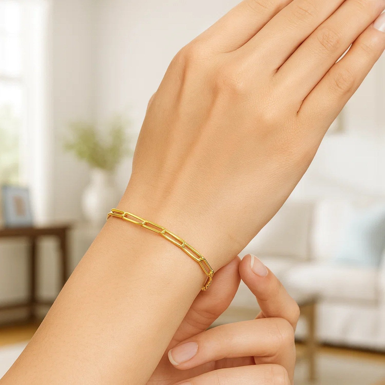 Modern 10K yellow gold paperclip bracelet featuring sleek links, perfect for elegant layering and everyday luxury.