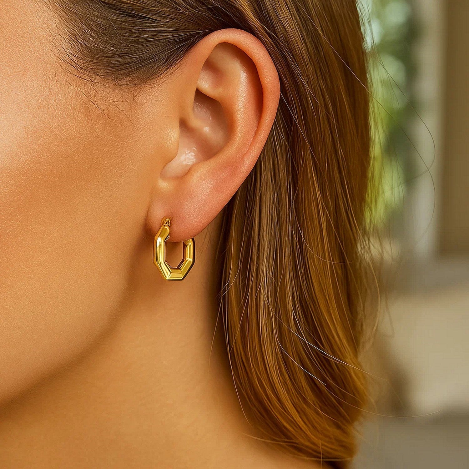 14k yellow gold polished hoop earrings with a sleek modern design, perfect for elegant everyday wear.