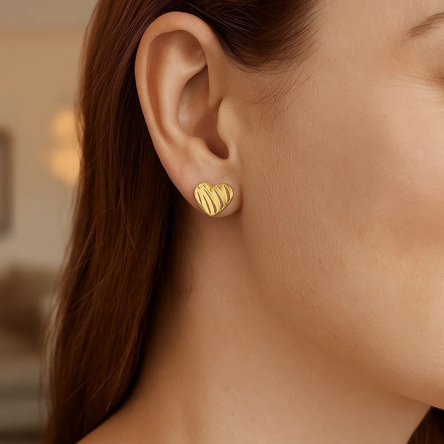 14k yellow gold high polish stud earrings in a modern scribble heart design, perfect for elegant occasions.