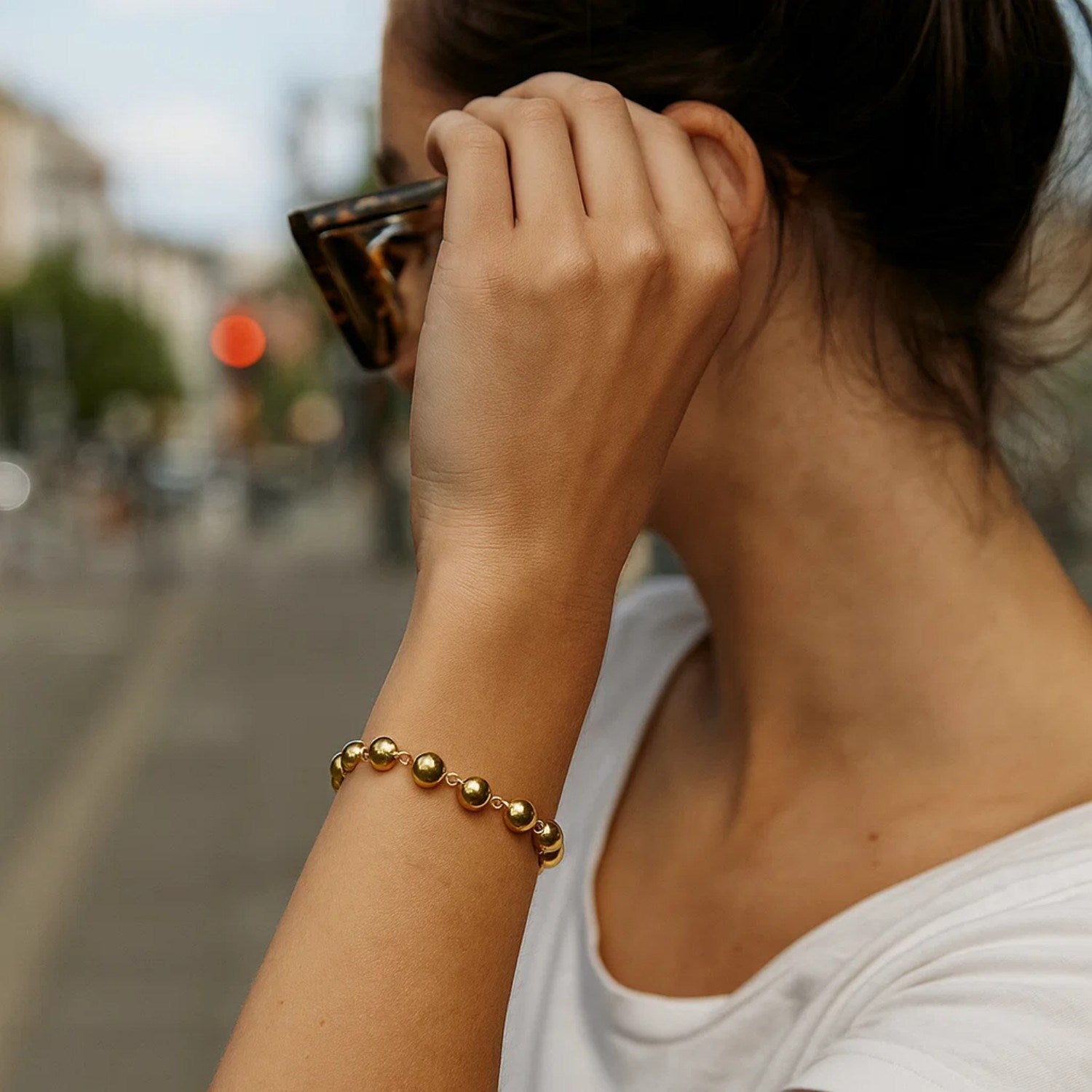 14k yellow gold polished pebble bead bracelet with elegant chain design, perfect for sophisticated styling.