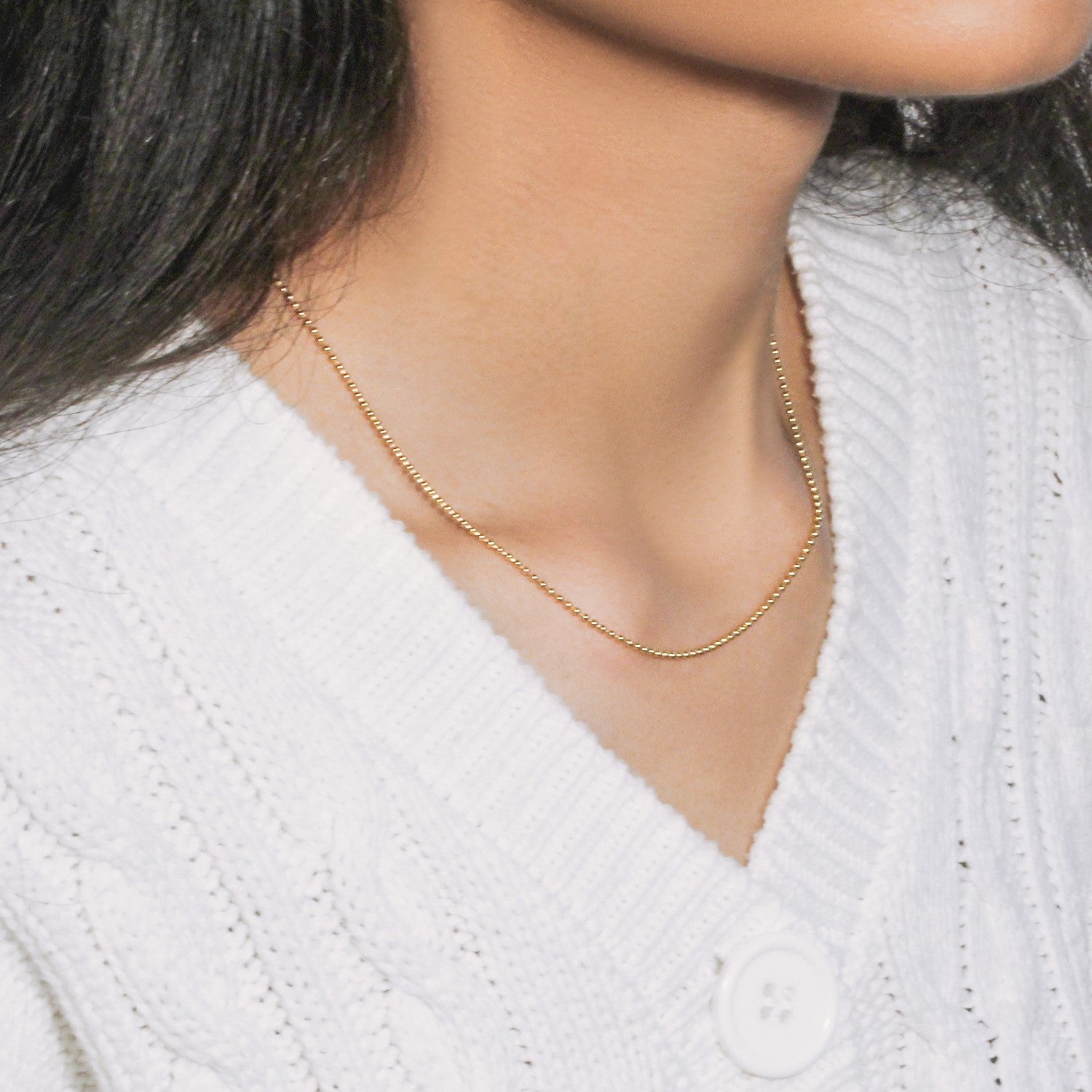 14k yellow gold bead chain, 1.5mm minimalist design, featuring elegant diamond accents for a luxurious touch.