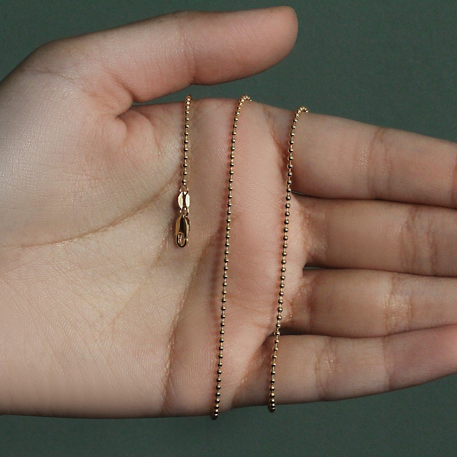 14k yellow gold bead chain, 1.5mm minimalist design, featuring exquisite diamond accents for a luxurious touch.