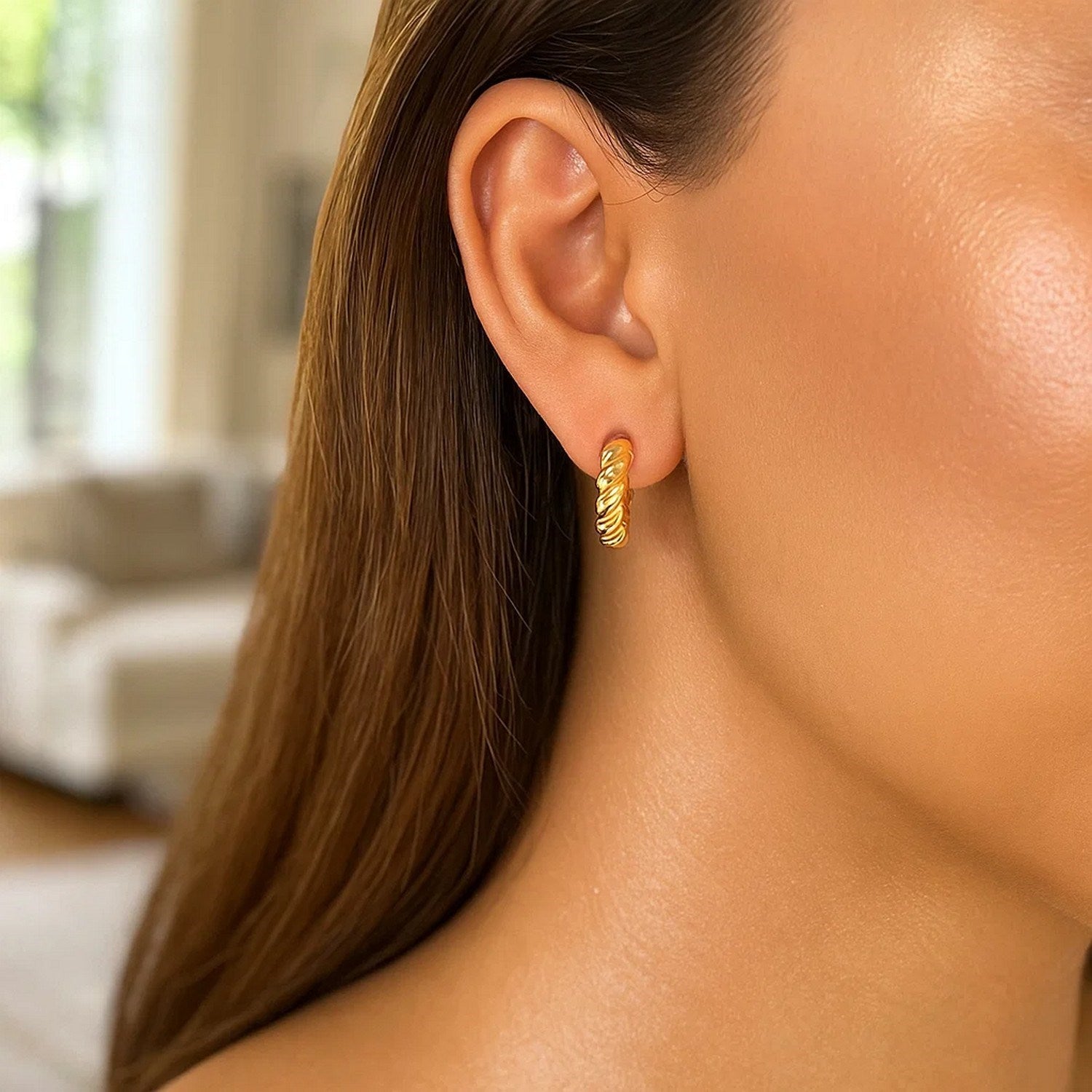 Elegant 14k yellow gold polished twisted hoop earrings showcasing a refined design for sophisticated style.