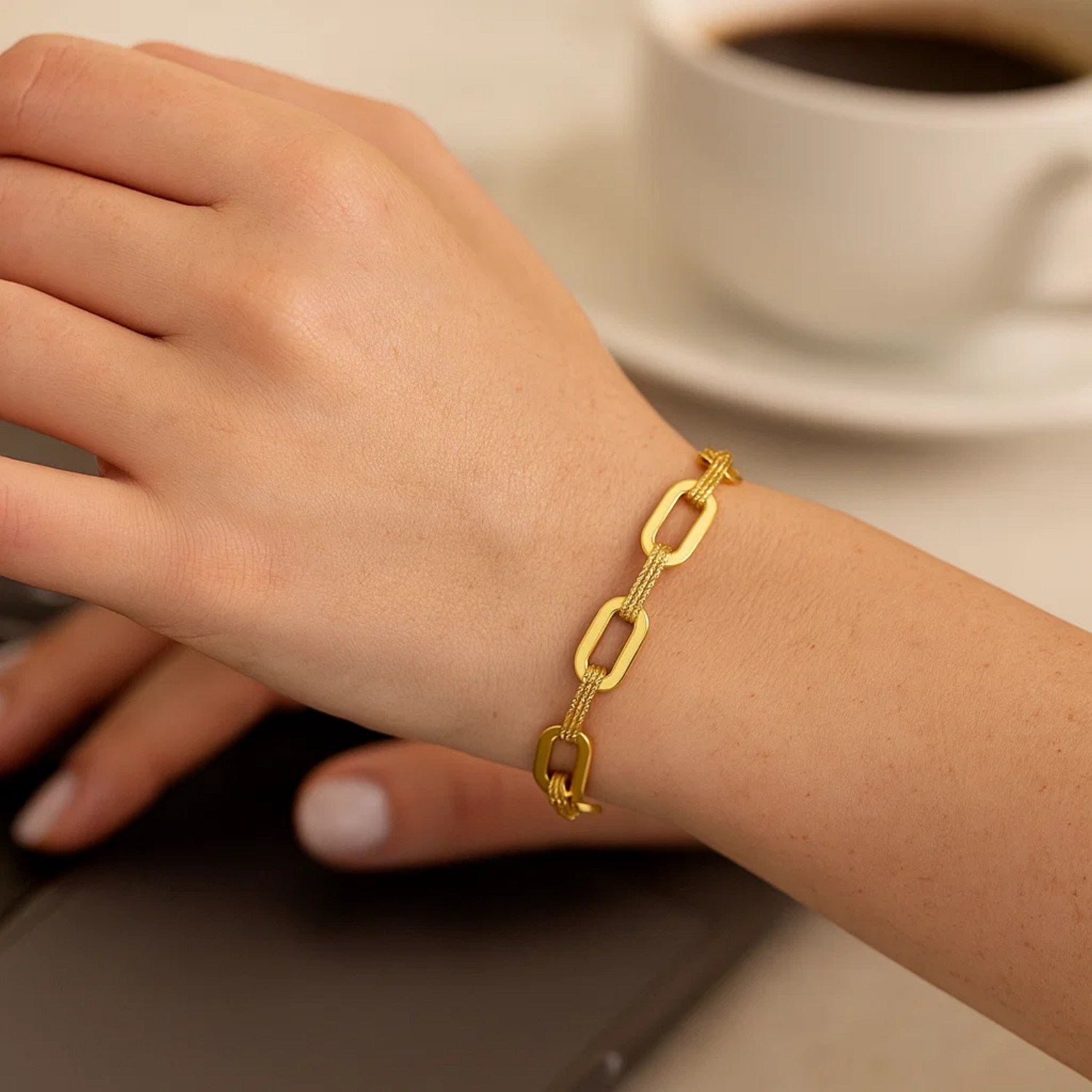 14k yellow gold diamante paperclip chain bracelet with modern design and elegant round links, perfect for luxury styling.