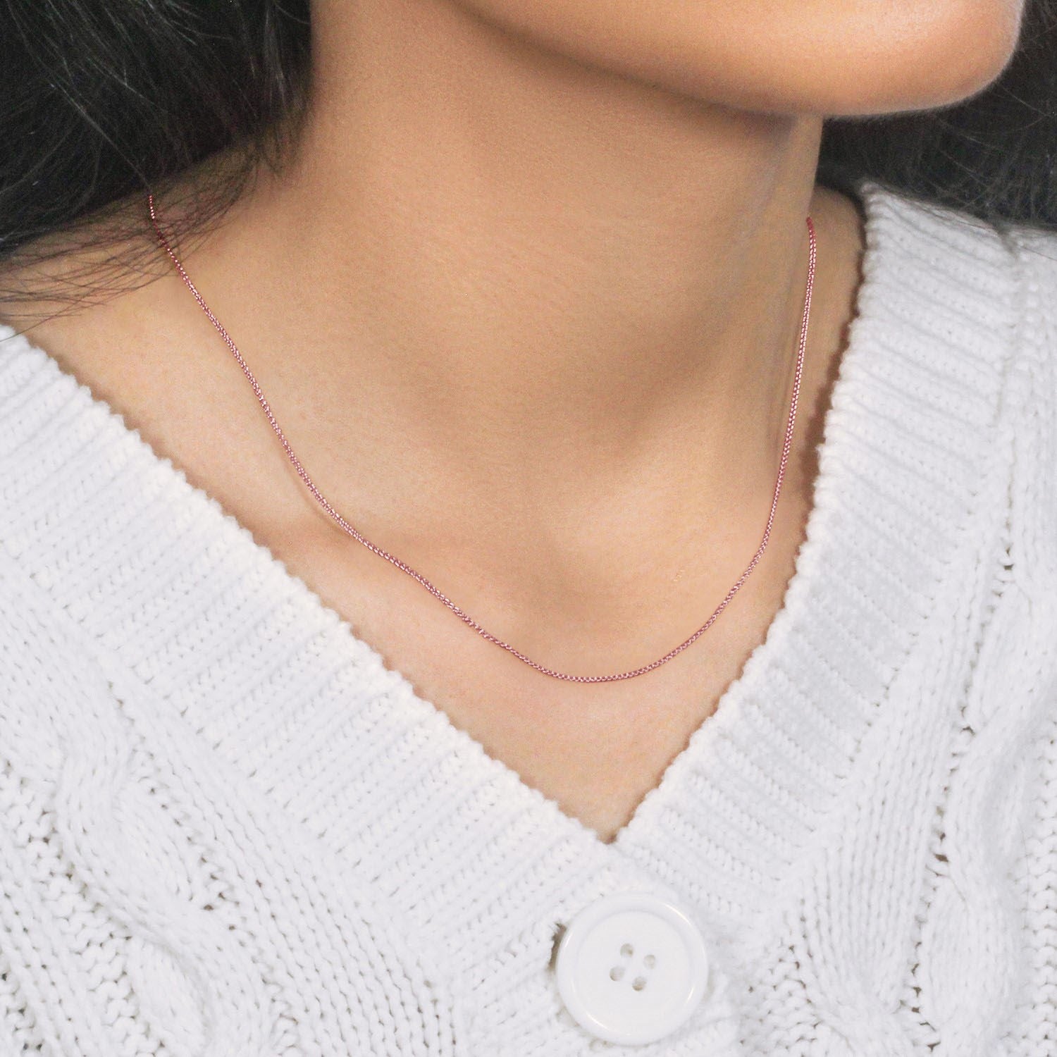 14k rose gold round wheat chain, elegantly crafted with a delicate design, perfect for layering or standalone wear.
