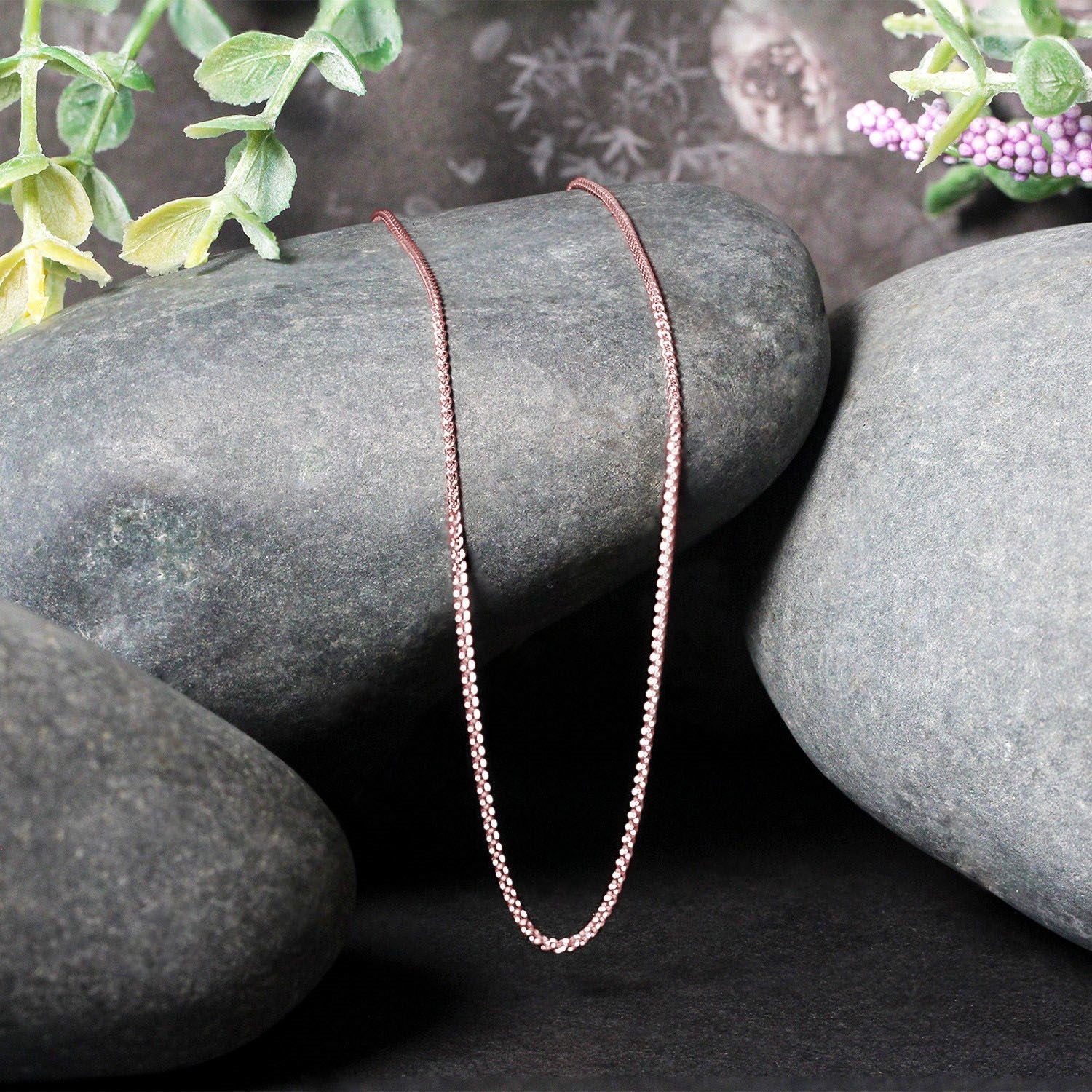 Elegant 14k rose gold round wheat chain, 1.00 mm, showcasing a refined design perfect for layering or solo wear.