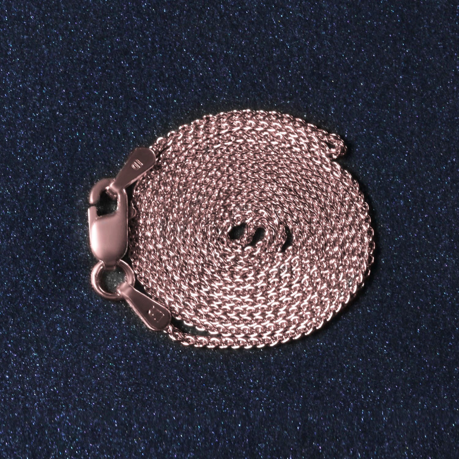 14k rose gold round wheat chain, elegantly crafted with a delicate design, perfect for layering or standalone wear.