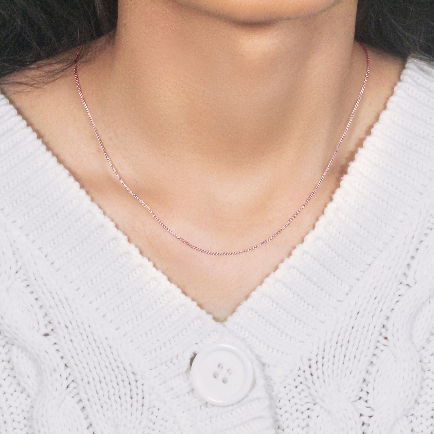 Elegant 14k rose gold round wheat chain, showcasing a refined design perfect for layering or standalone wear.