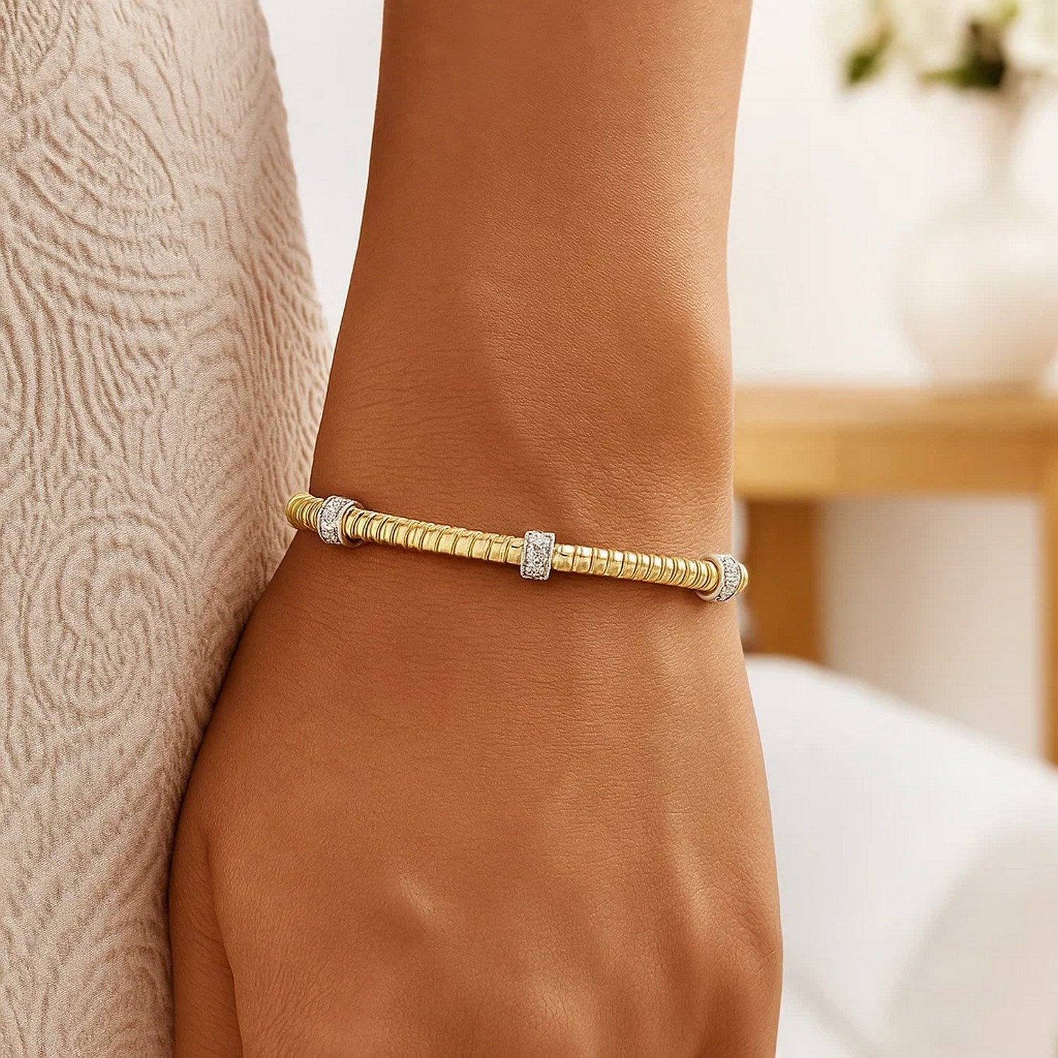 14K yellow gold diamond triple station tubogas bracelet showcasing modern elegance and luxurious craftsmanship.