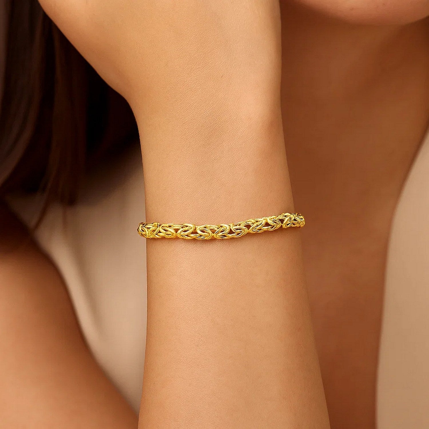 14k yellow gold Byzantine link bracelet with a shiny finish, showcasing classic elegance and timeless design.