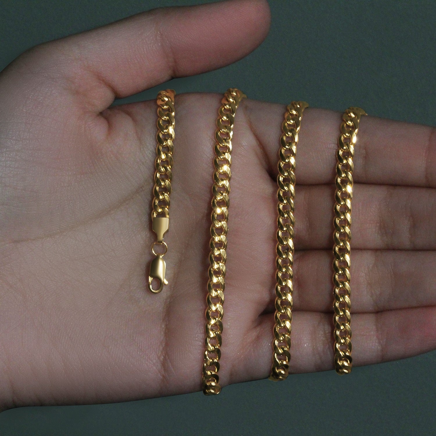 Elegant 10k yellow gold Miami Cuban semi-solid chain, 4.50 mm links, showcasing luxurious craftsmanship and timeless style.