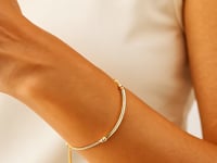 Lasso-Armband aus 14 Karat Gelbgold mit poliertem, gebogenem Stab