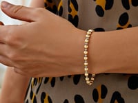 Bracelet en or bicolore 14 carats avec perles taillées en diamant poli (4,00 mm)