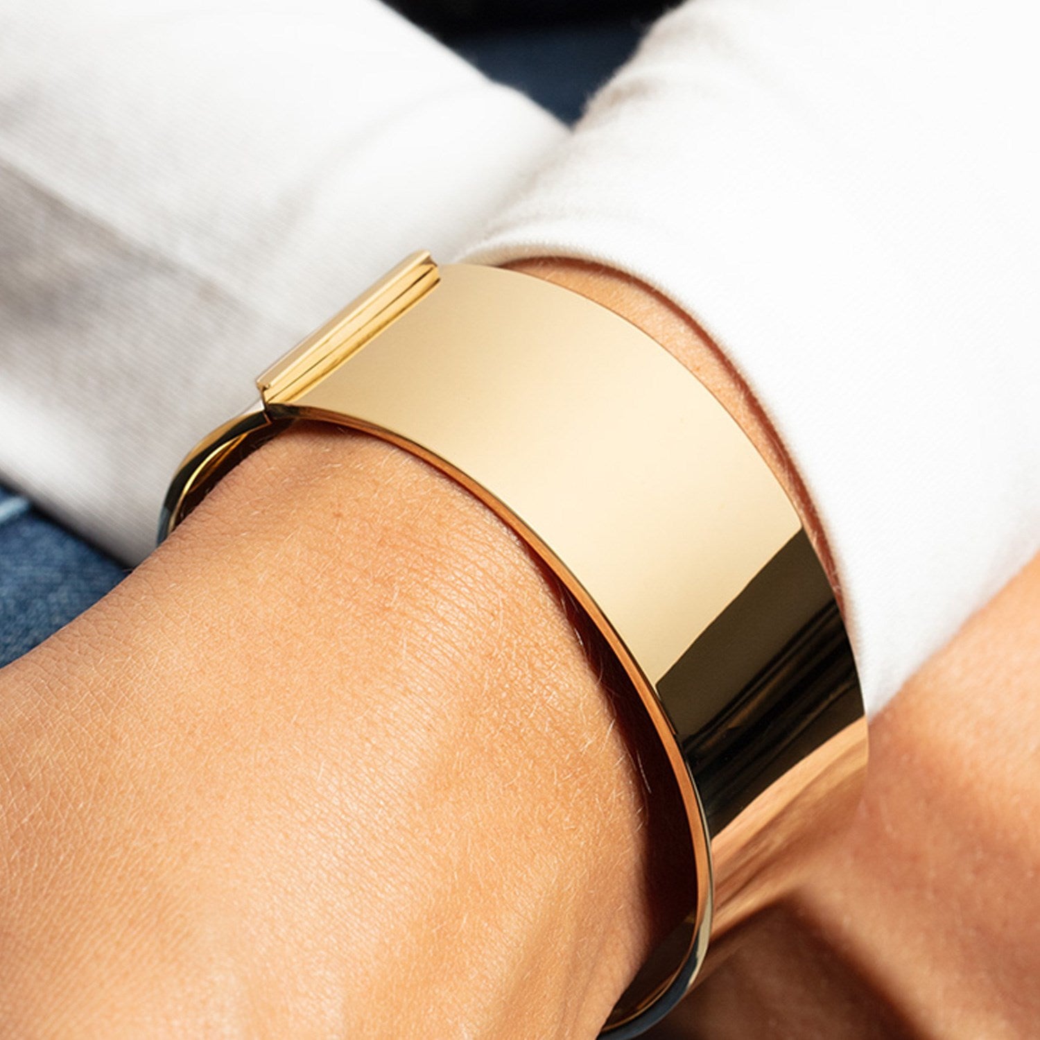 Bold 14k yellow gold bracelet with modern design, showcasing a luxurious 24.60 mm width for a statement look.