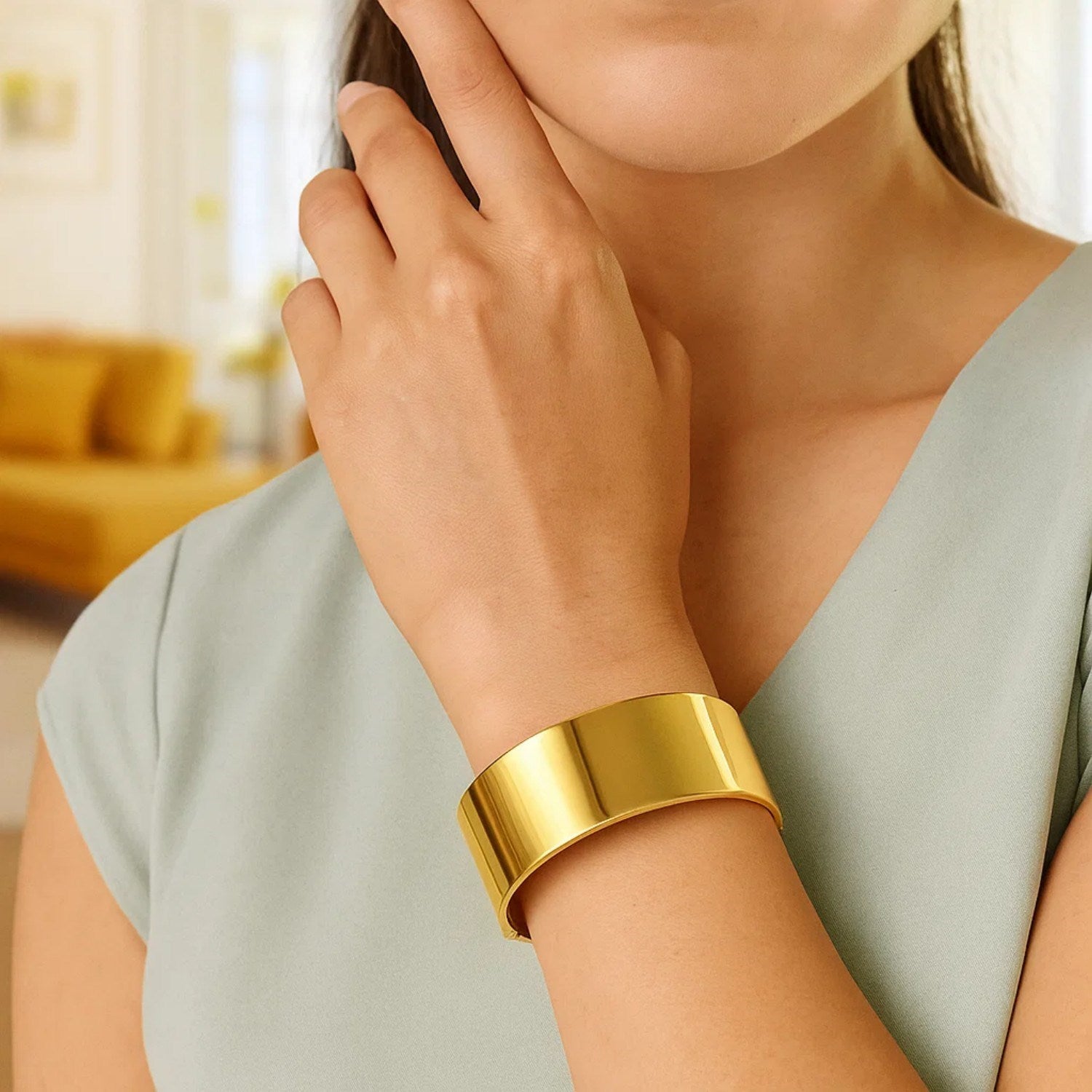 Designer bold width bracelet in 14k yellow gold, modern style with luxurious shine and exquisite craftsmanship.