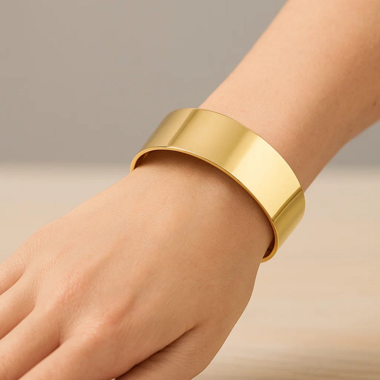 Bold 14k yellow gold bracelet with modern design, featuring a luxurious 24.60 mm width for a striking statement.