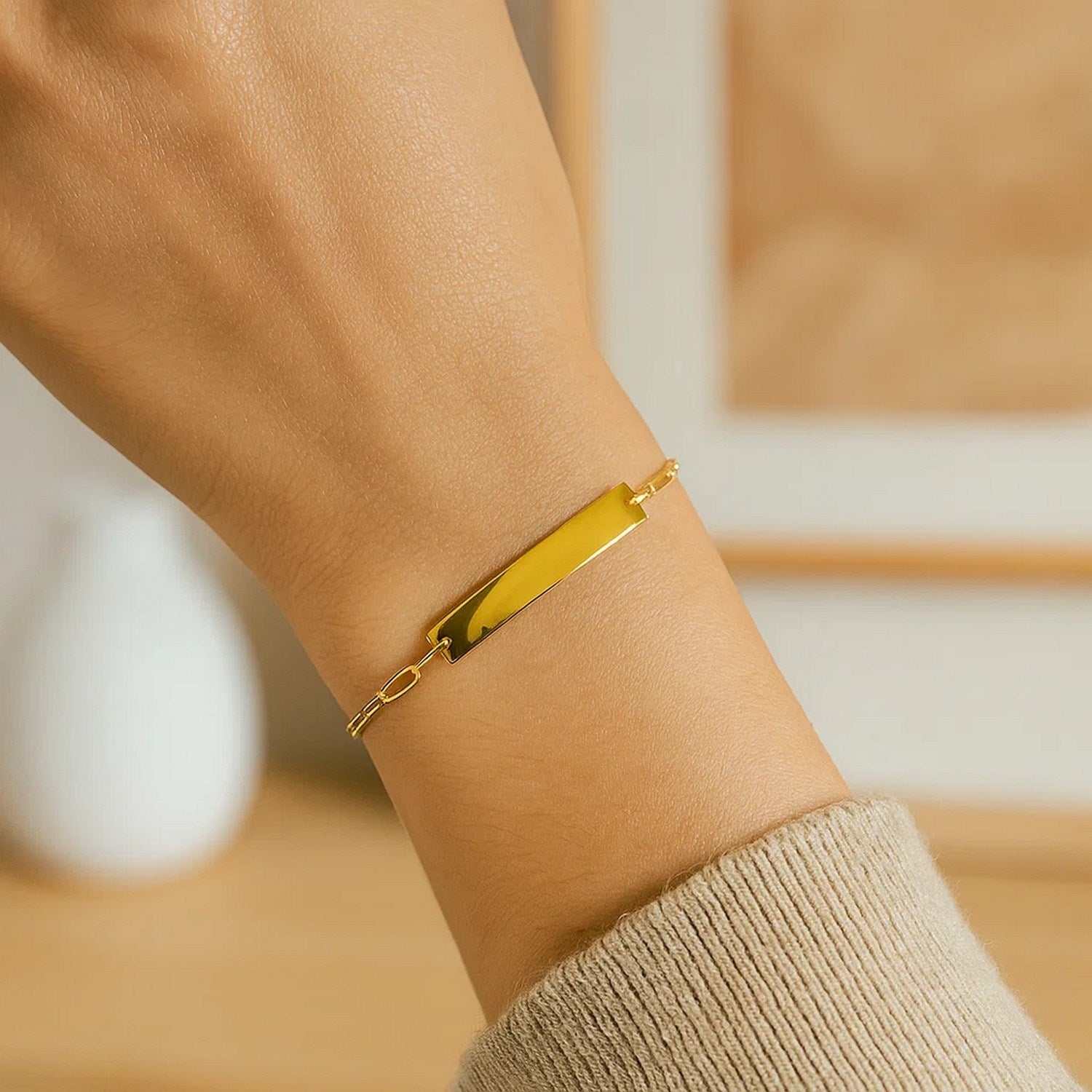 14k yellow gold modern paperclip chain bracelet with sleek bar design, 7 inches long, perfect for elegant layering.